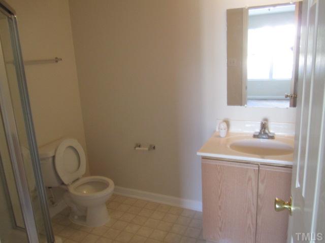 4360 Haverty Drive Raleigh, NC 27610 - Photo 7 of 9 a bathroom with a sink toilet and a mirror