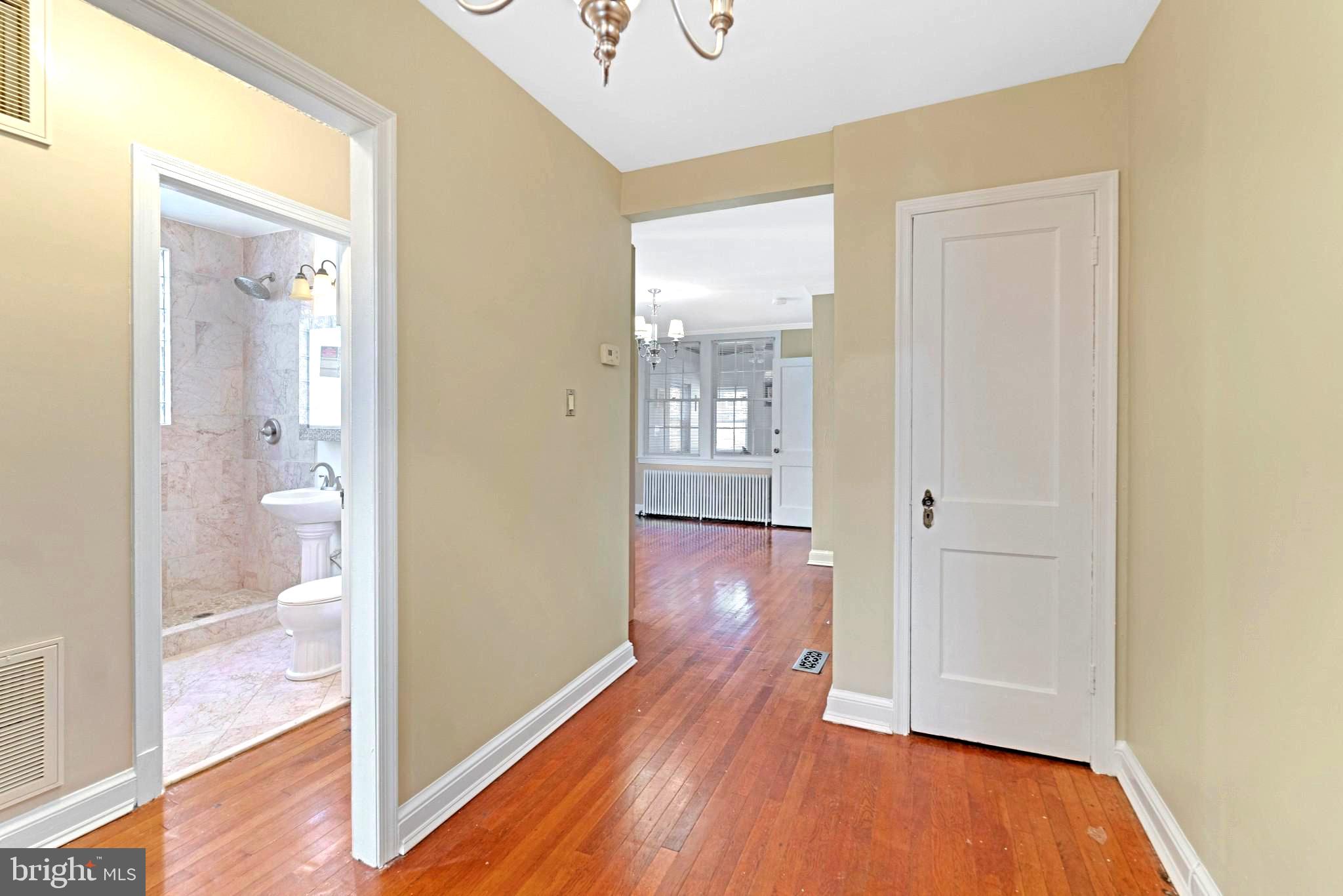 19 Hamilton Street Northeast, Unit 1 Washington, DC 20011 - Photo 6 of 17 Inviting hallway with warm tones.