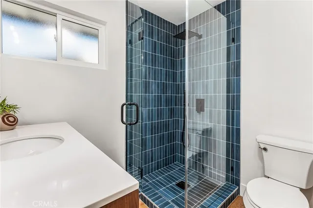 a bathroom with a toilet and a sink