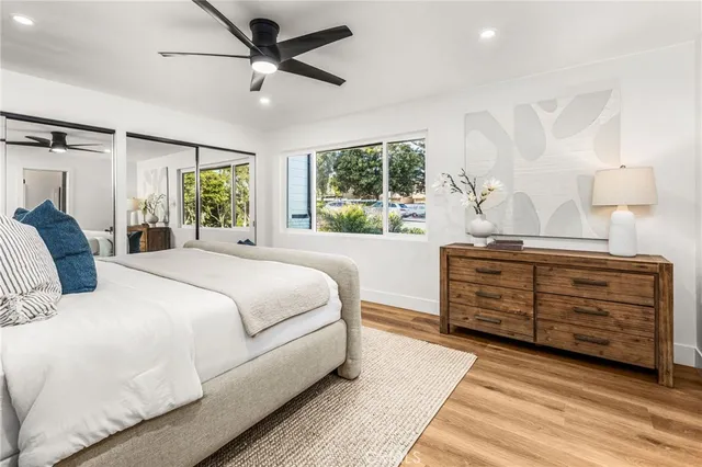 a bedroom with a bed and a dresser