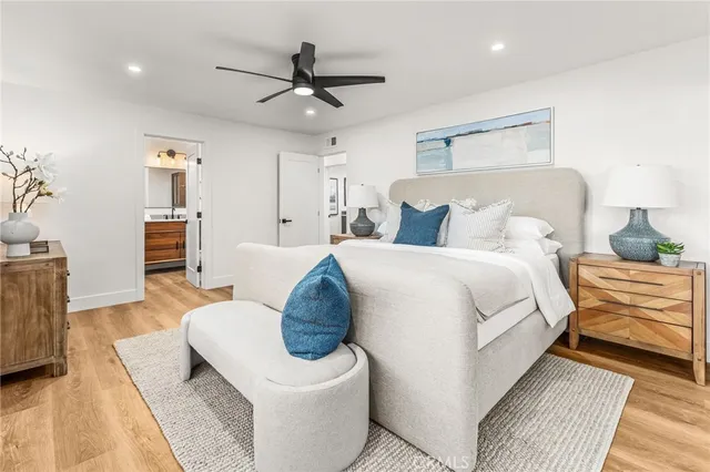 a bedroom with a large bed and a couch