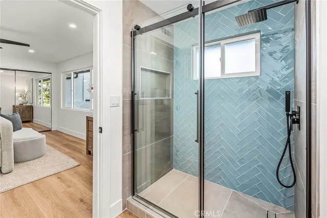 a bathroom with a glass shower door