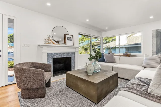 a living room with furniture and a fireplace