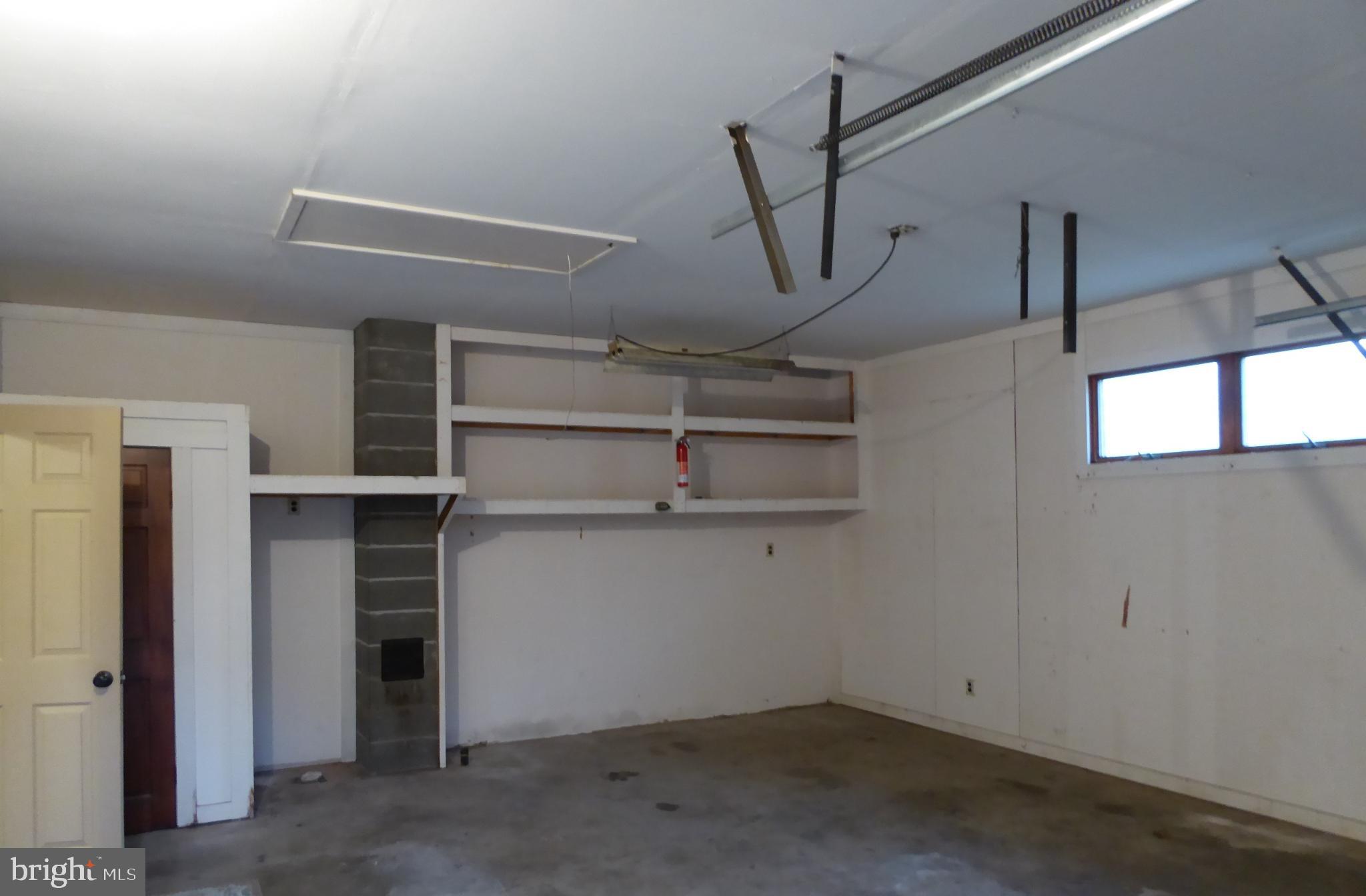 102 Dry Run Road Burlington, WV 26710 - Photo 22 of 85 Spacious garage with potential for creativity.
