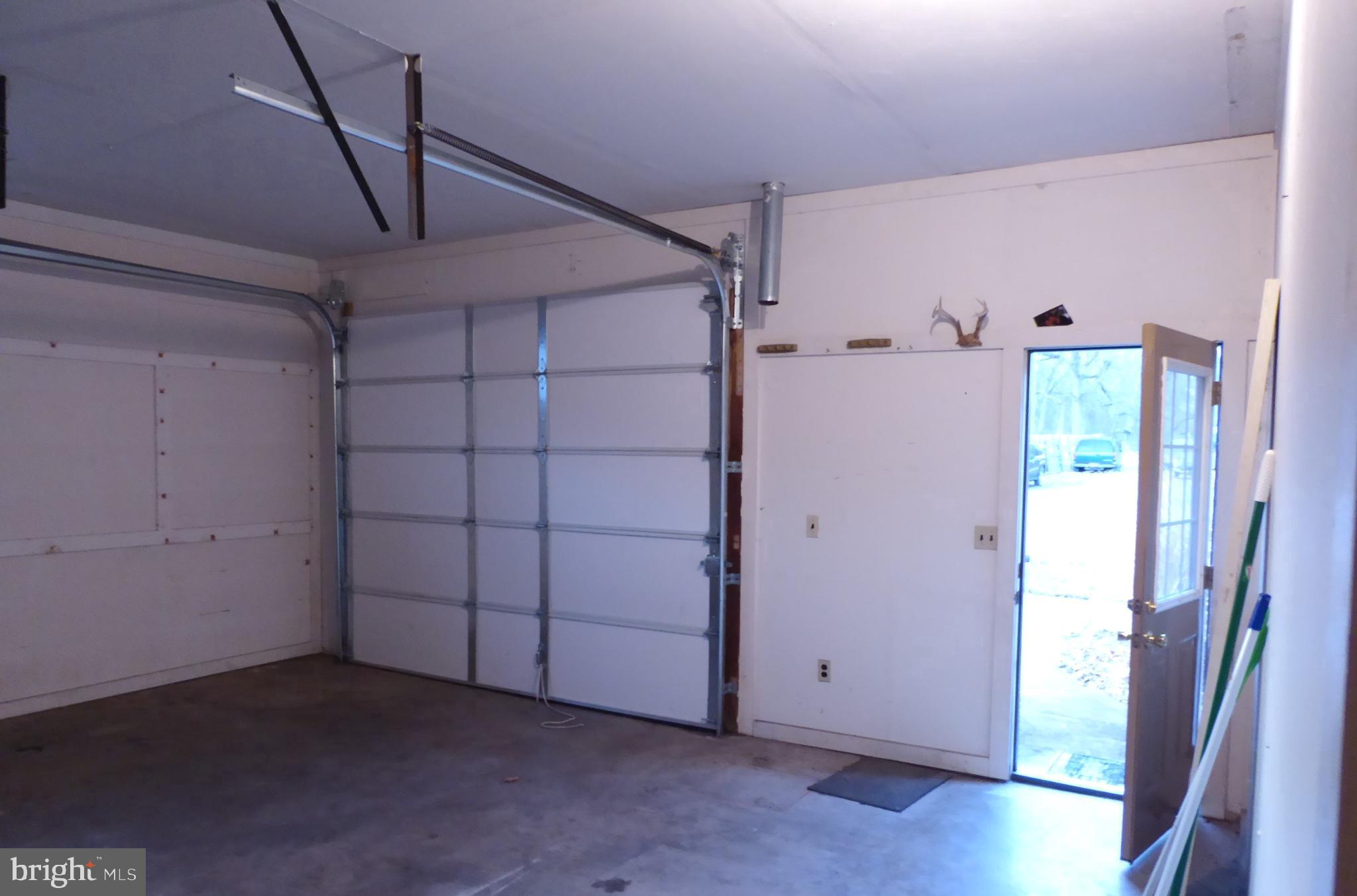 102 Dry Run Road Burlington, WV 26710 - Photo 23 of 85 Spacious garage with natural light access.