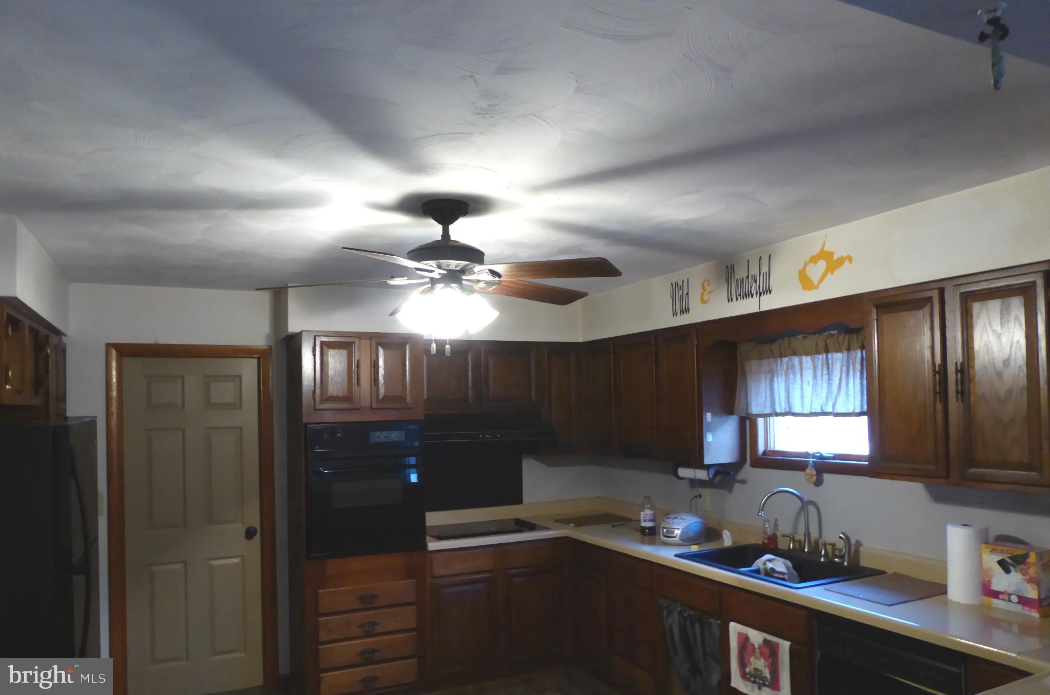 102 Dry Run Road Burlington, WV 26710 - Photo 27 of 85 Warm and inviting kitchen with classic charm.