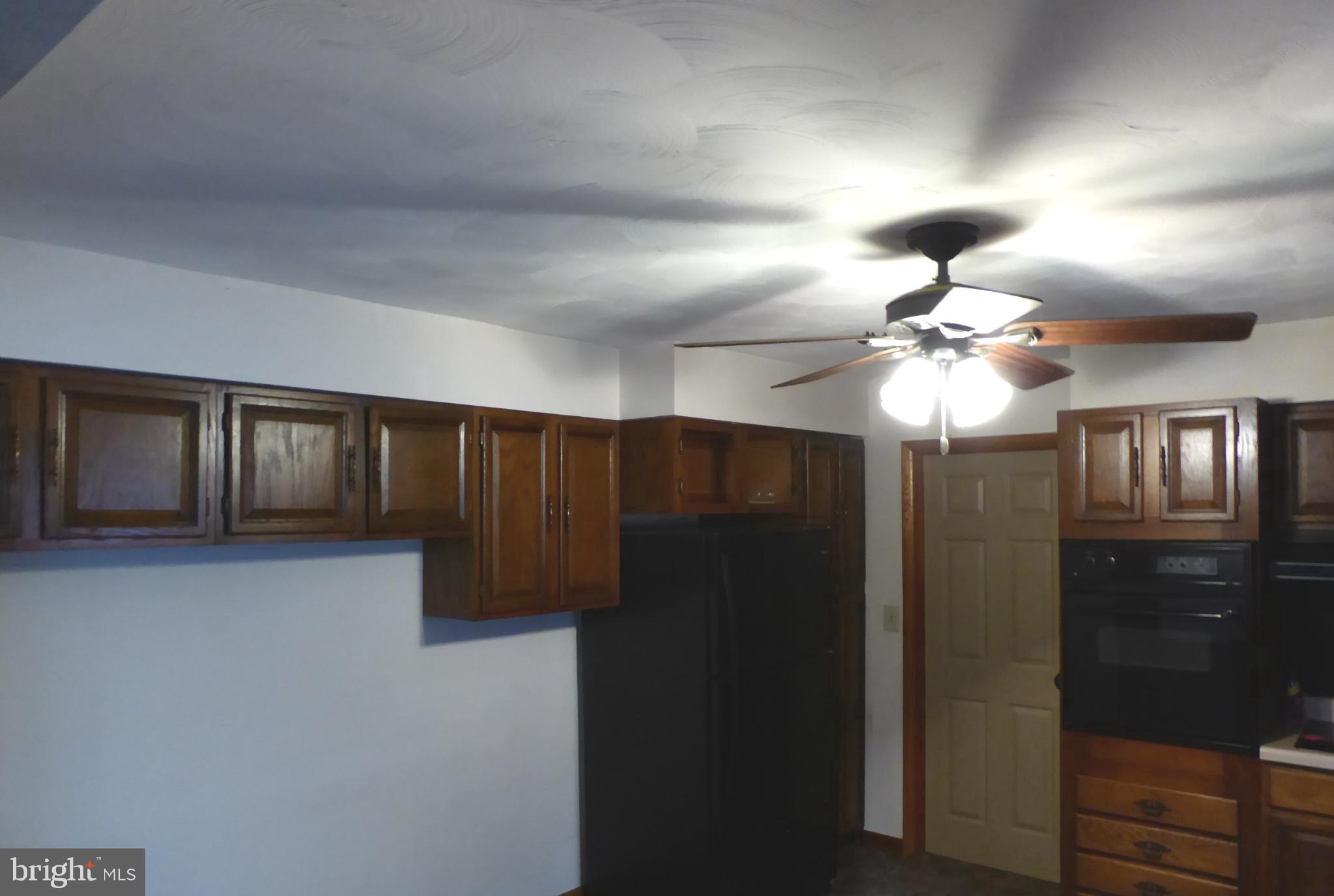 102 Dry Run Road Burlington, WV 26710 - Photo 31 of 85 Cozy kitchen with classic wooden cabinetry.