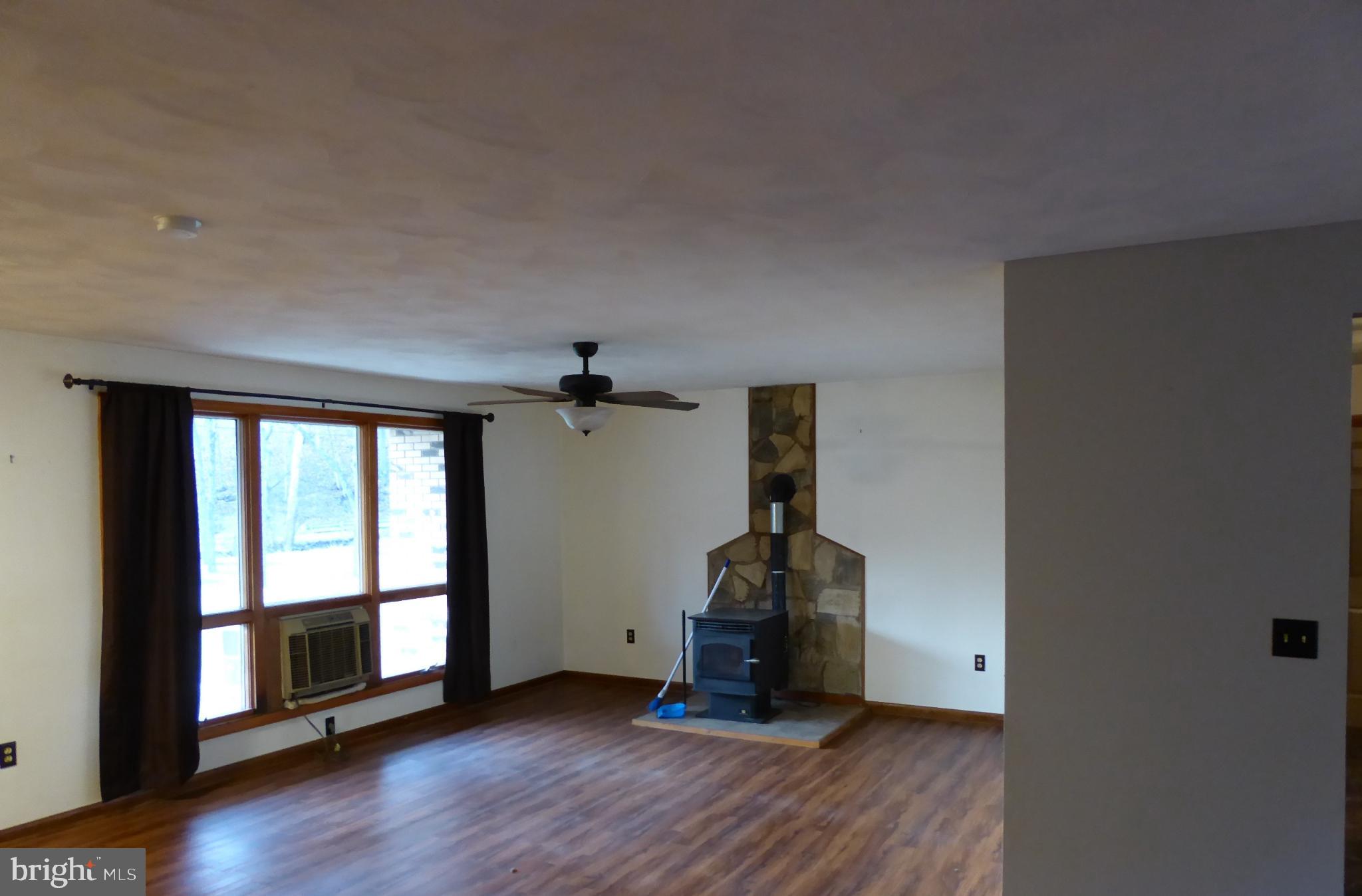 102 Dry Run Road Burlington, WV 26710 - Photo 36 of 85 Spacious living area with cozy fireplace.