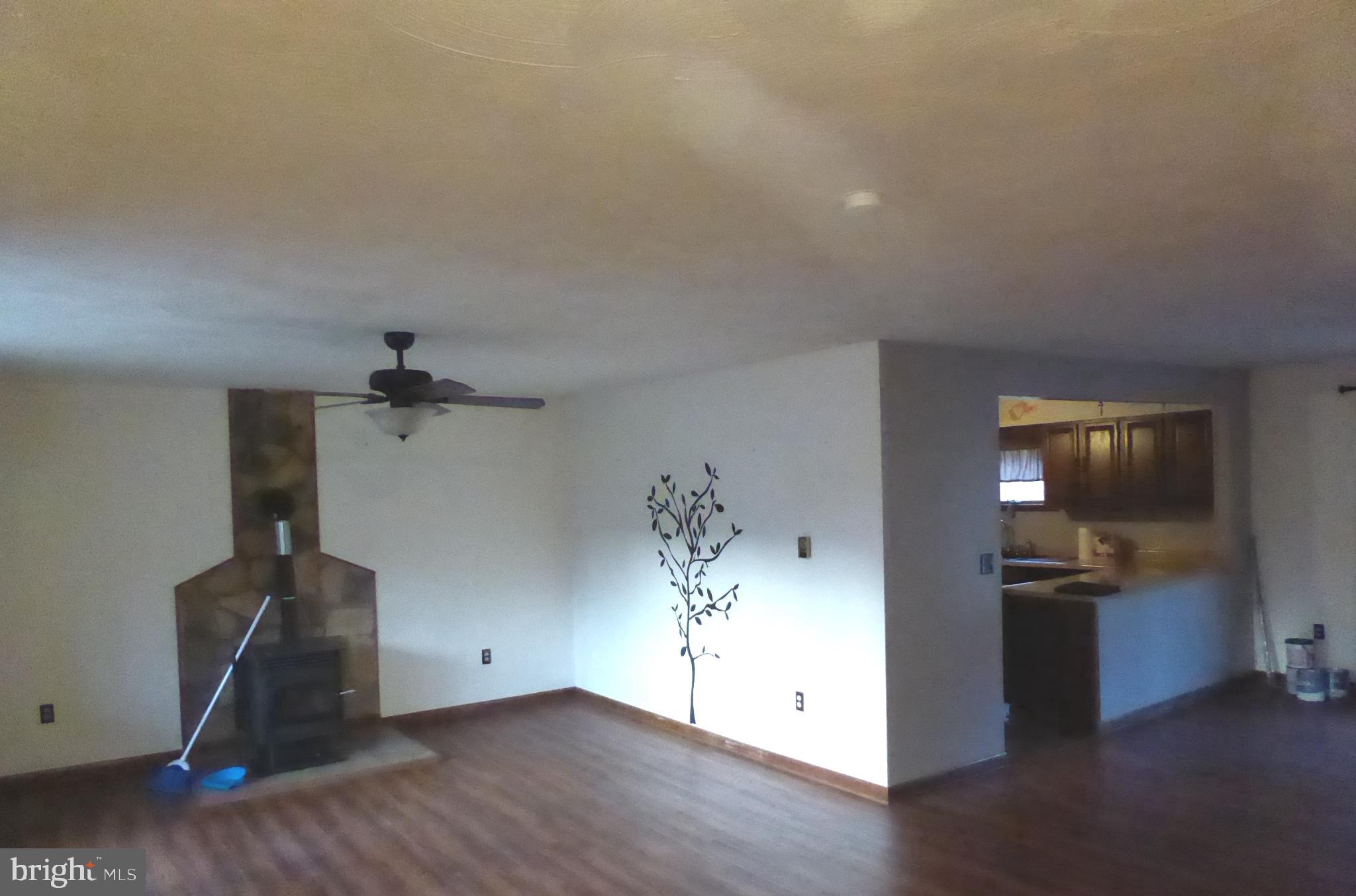 102 Dry Run Road Burlington, WV 26710 - Photo 37 of 85 Spacious living area with rustic charm.