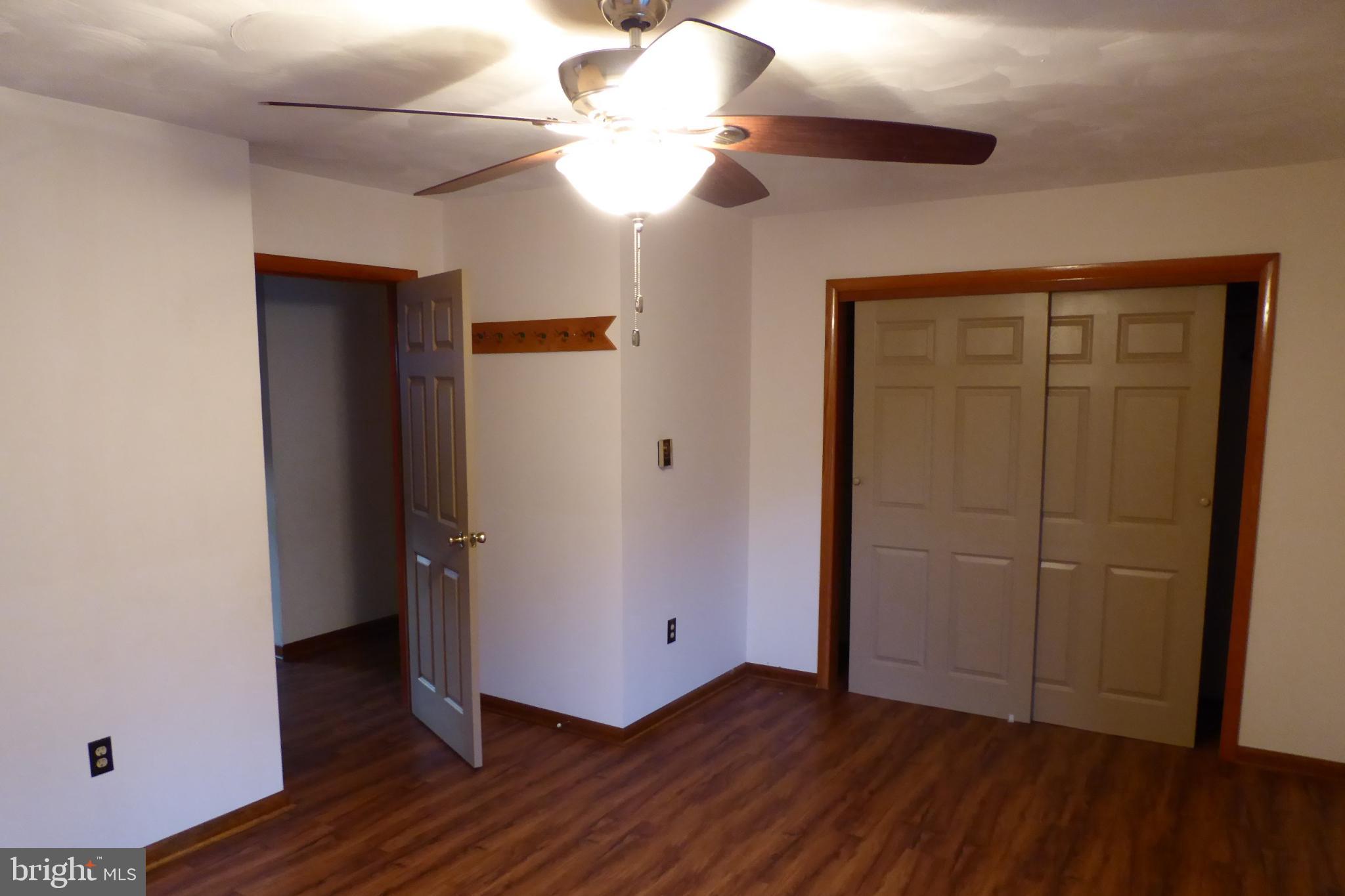 102 Dry Run Road Burlington, WV 26710 - Photo 41 of 85 Spacious room with warm wood accents.
