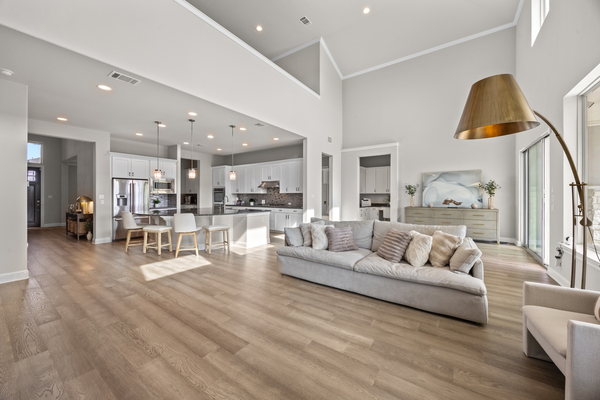 15705 Colinas Cove Bee Cave, TX 78738 - Photo 12 of 40 a living room with furniture and kitchen view