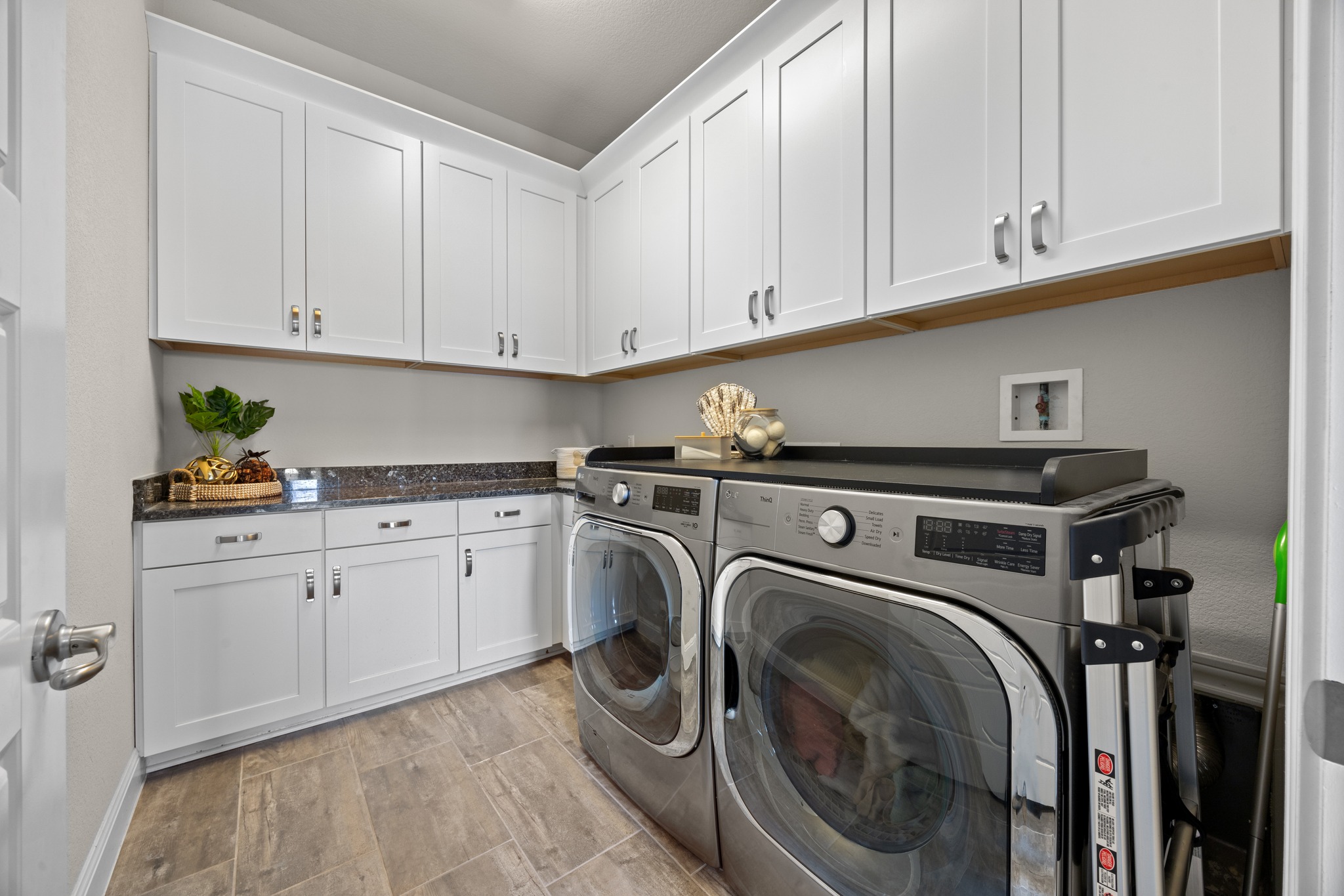 15705 Colinas Cove Bee Cave, TX 78738 - Photo 26 of 40 a utility room with sink dryer and washer