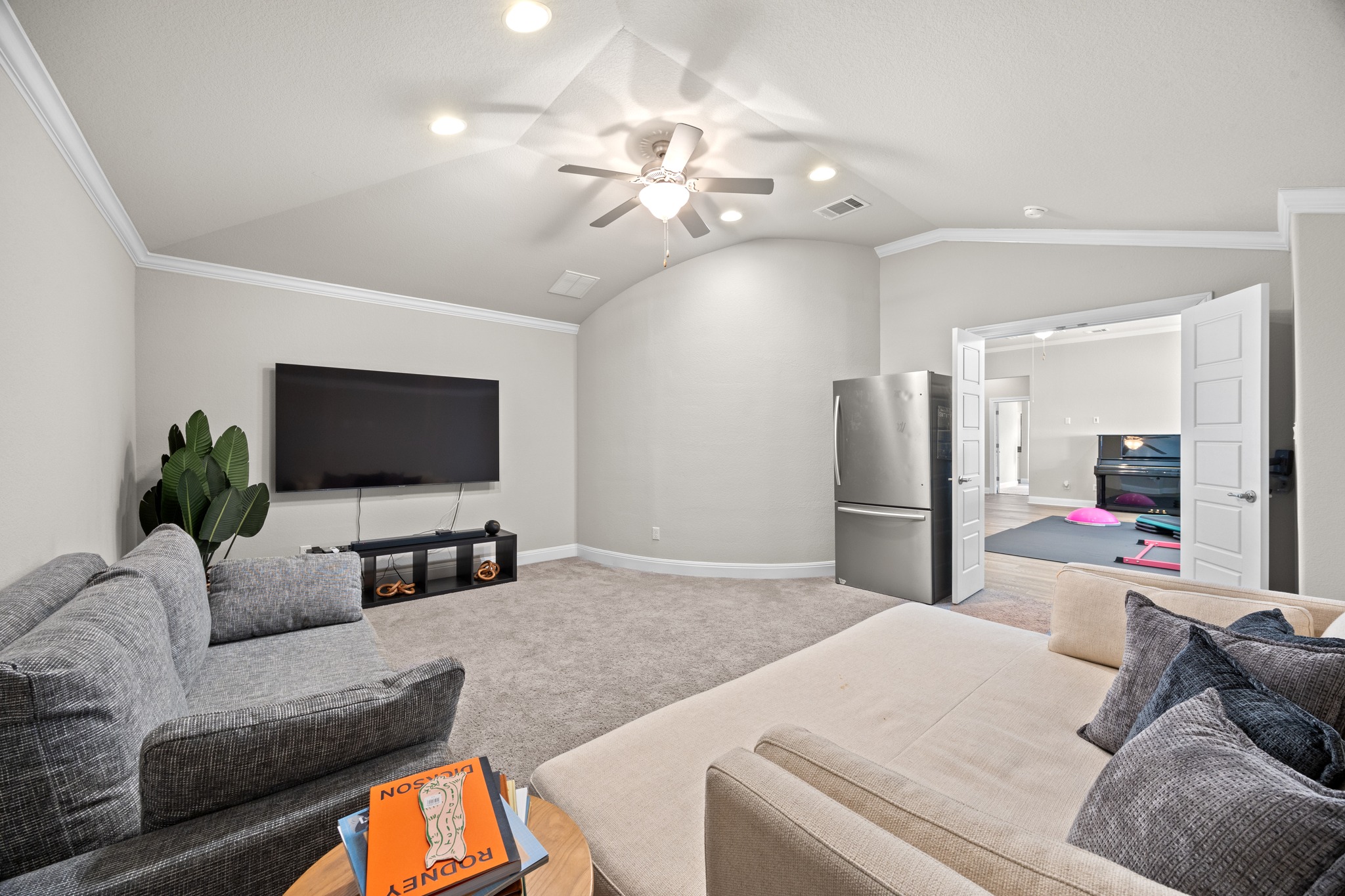 15705 Colinas Cove Bee Cave, TX 78738 - Photo 28 of 40 a living room with furniture and a flat screen tv