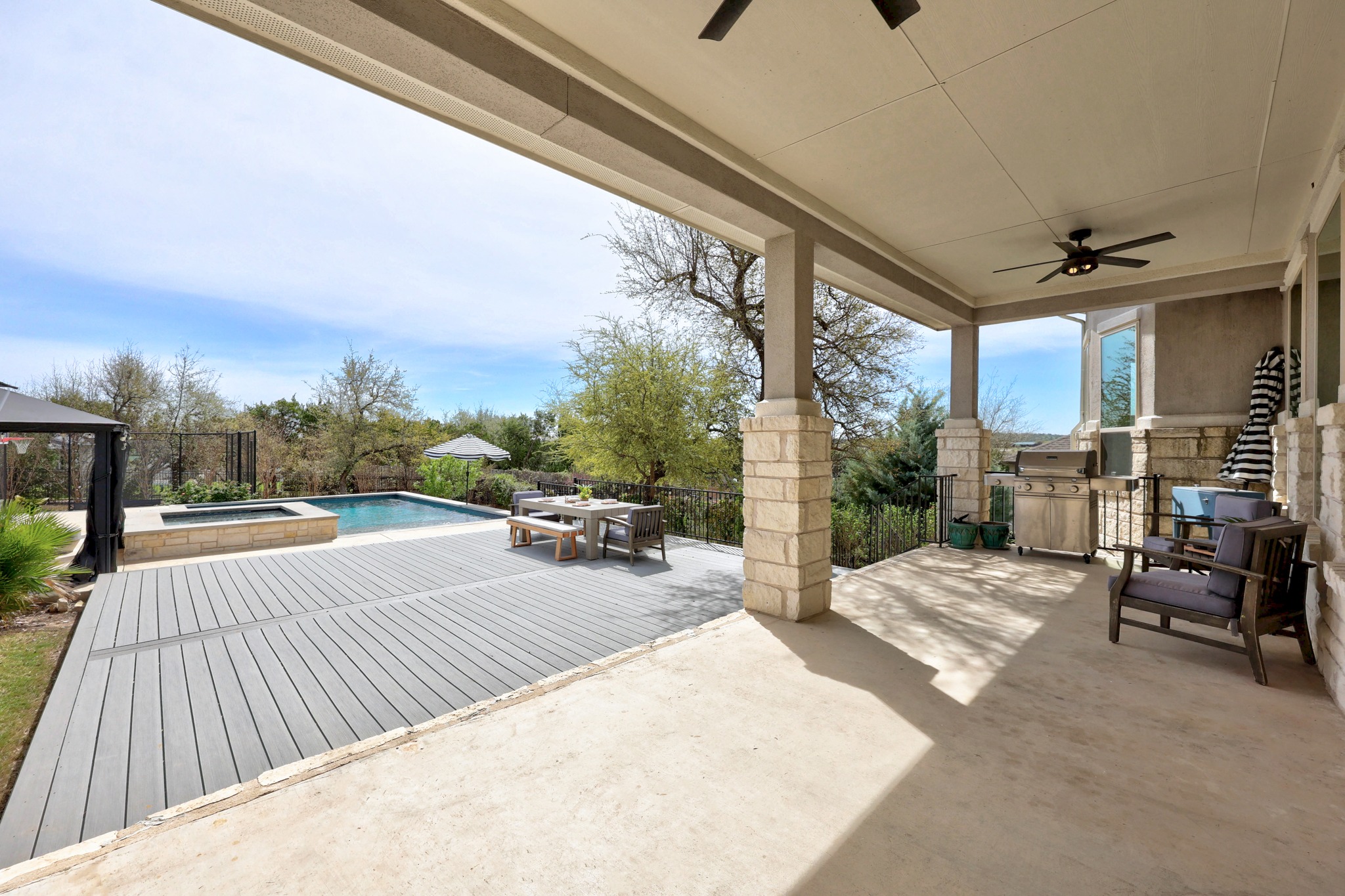 15705 Colinas Cove Bee Cave, TX 78738 - Photo 32 of 40 View of patio with ceiling fan, a pool with connected hot tub, an outdoor kitchen / dining area, and a gazebo