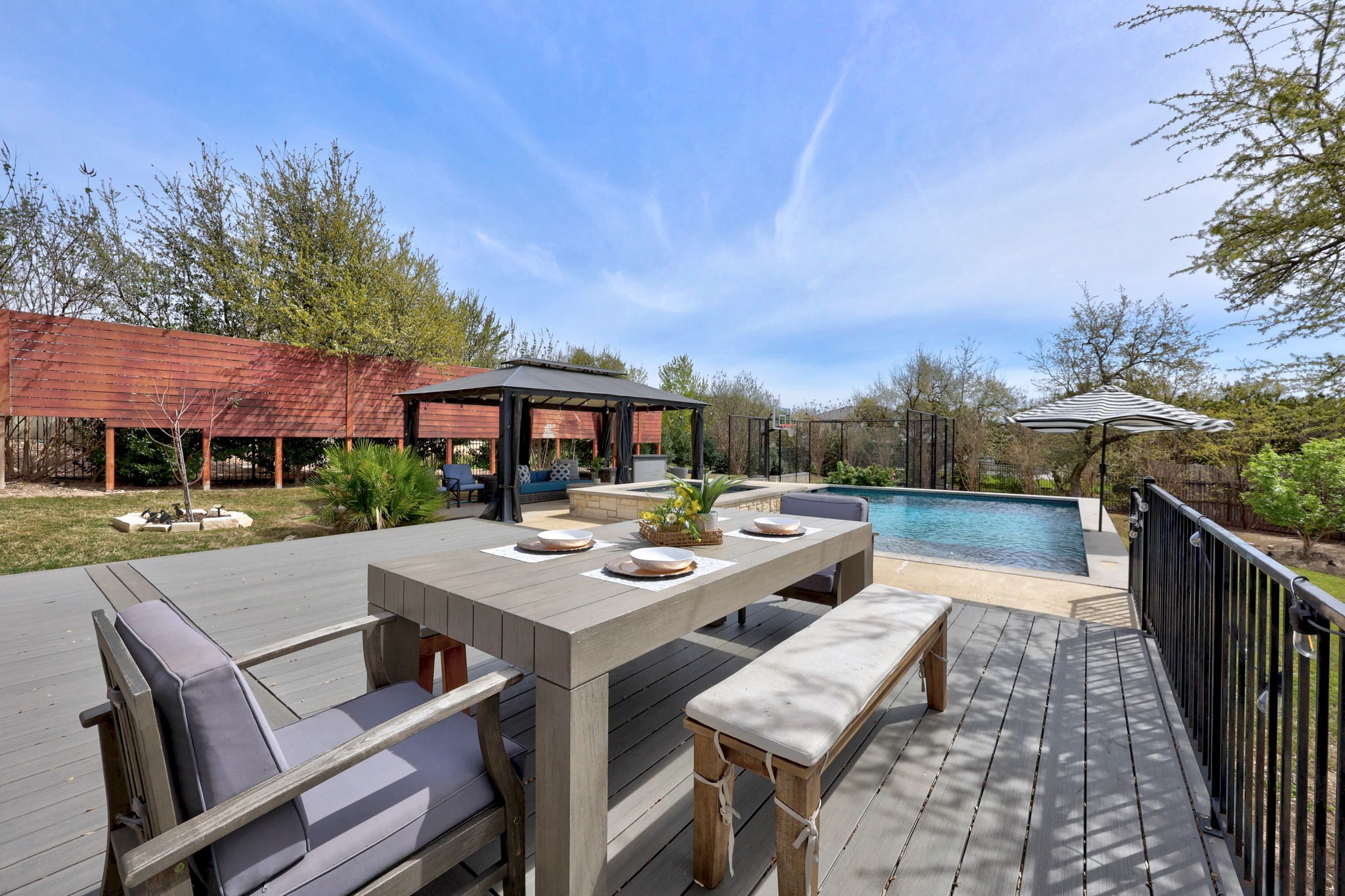 15705 Colinas Cove Bee Cave, TX 78738 - Photo 34 of 40 a view of house with patio outdoor seating and city view