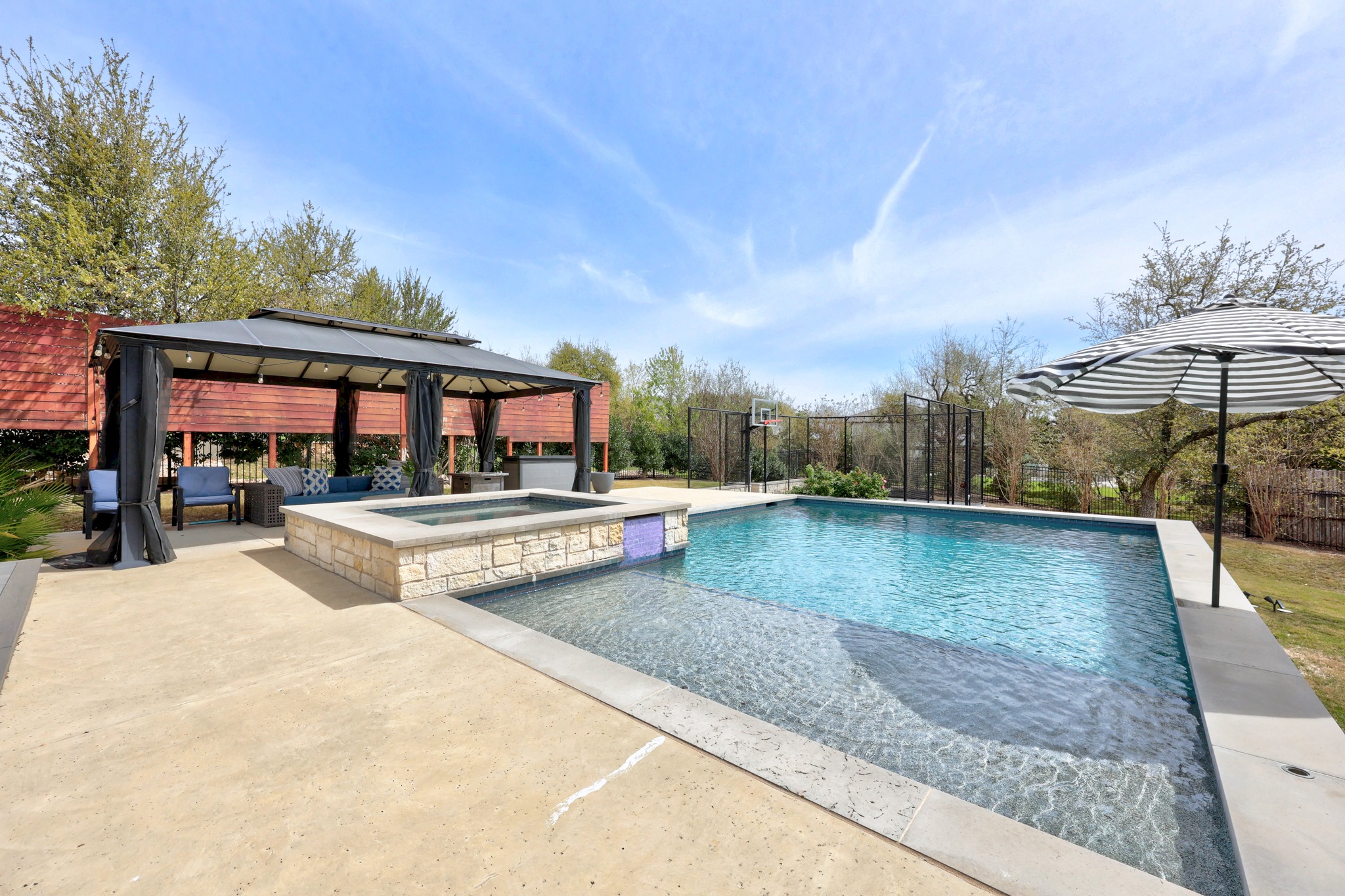 15705 Colinas Cove Bee Cave, TX 78738 - Photo 35 of 40 Integrated pool / spa featuring a fenced backyard, a patio area, and a gazebo