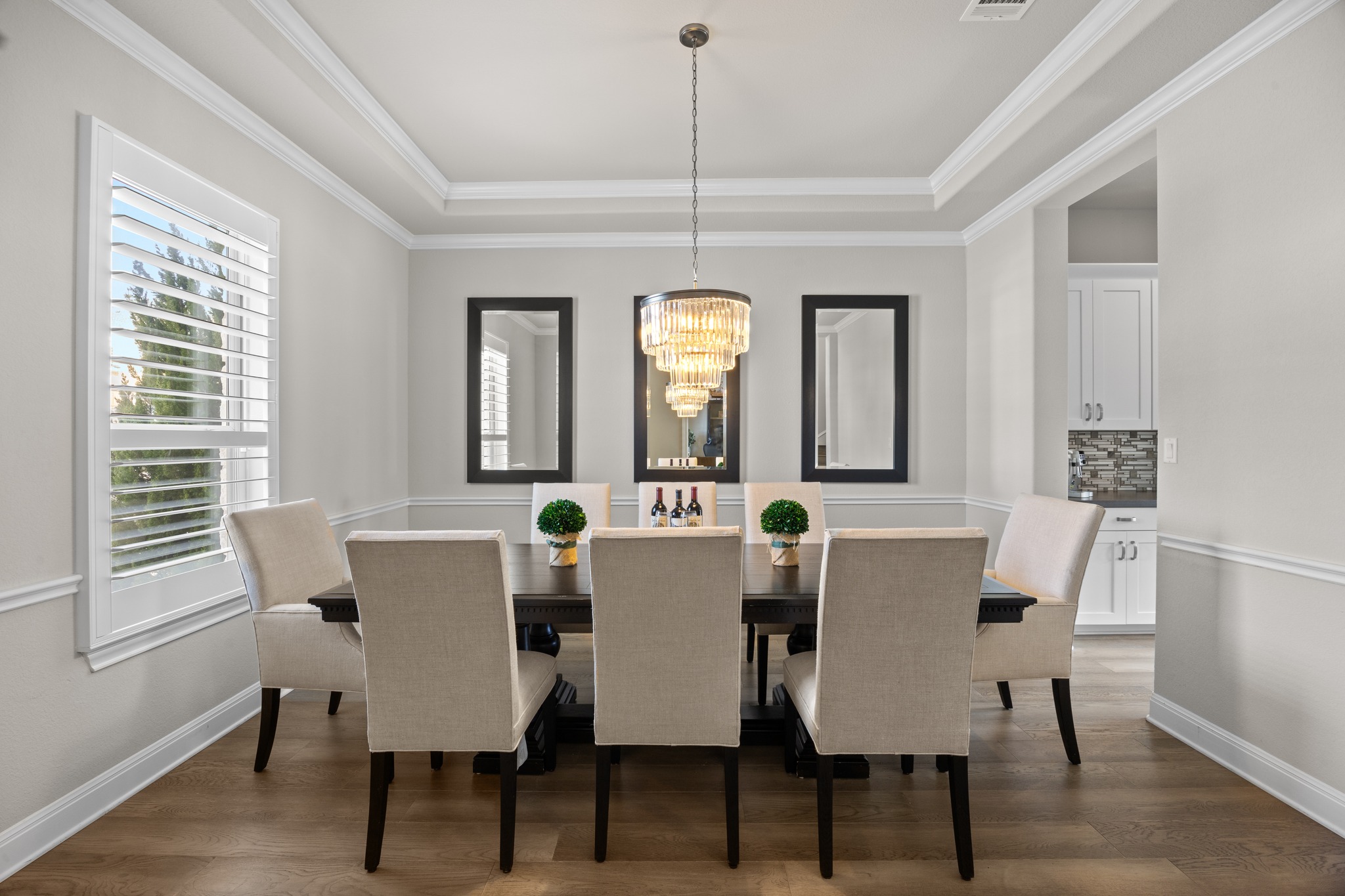 15705 Colinas Cove Bee Cave, TX 78738 - Photo 6 of 40 a view of a dining room with furniture window and wooden floor