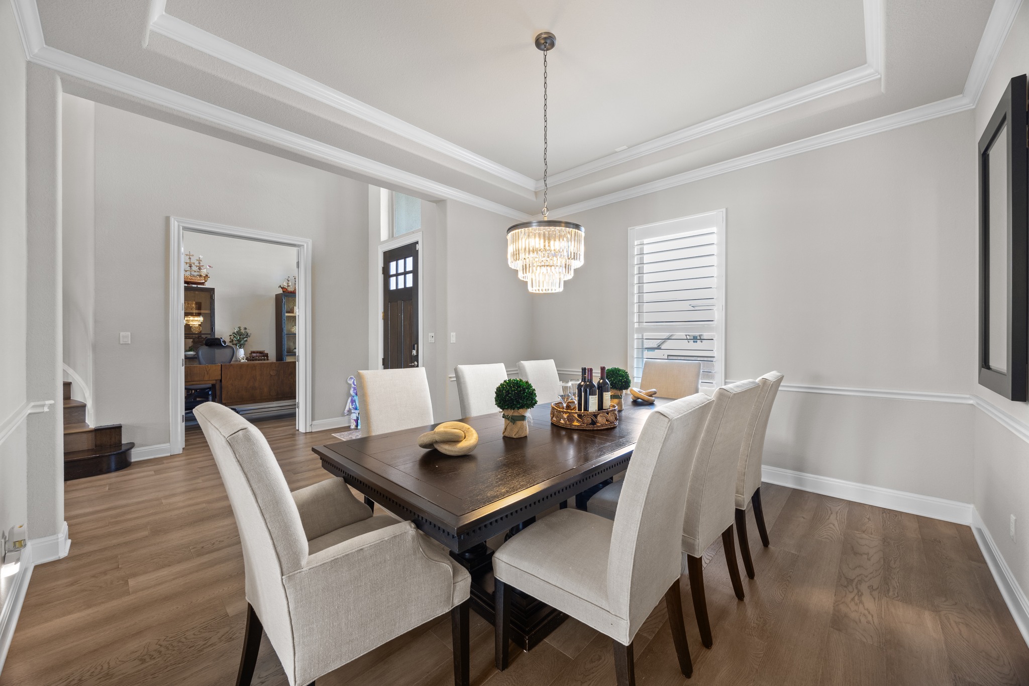 15705 Colinas Cove Bee Cave, TX 78738 - Photo 7 of 40 a view of a dining room with furniture window and wooden floor