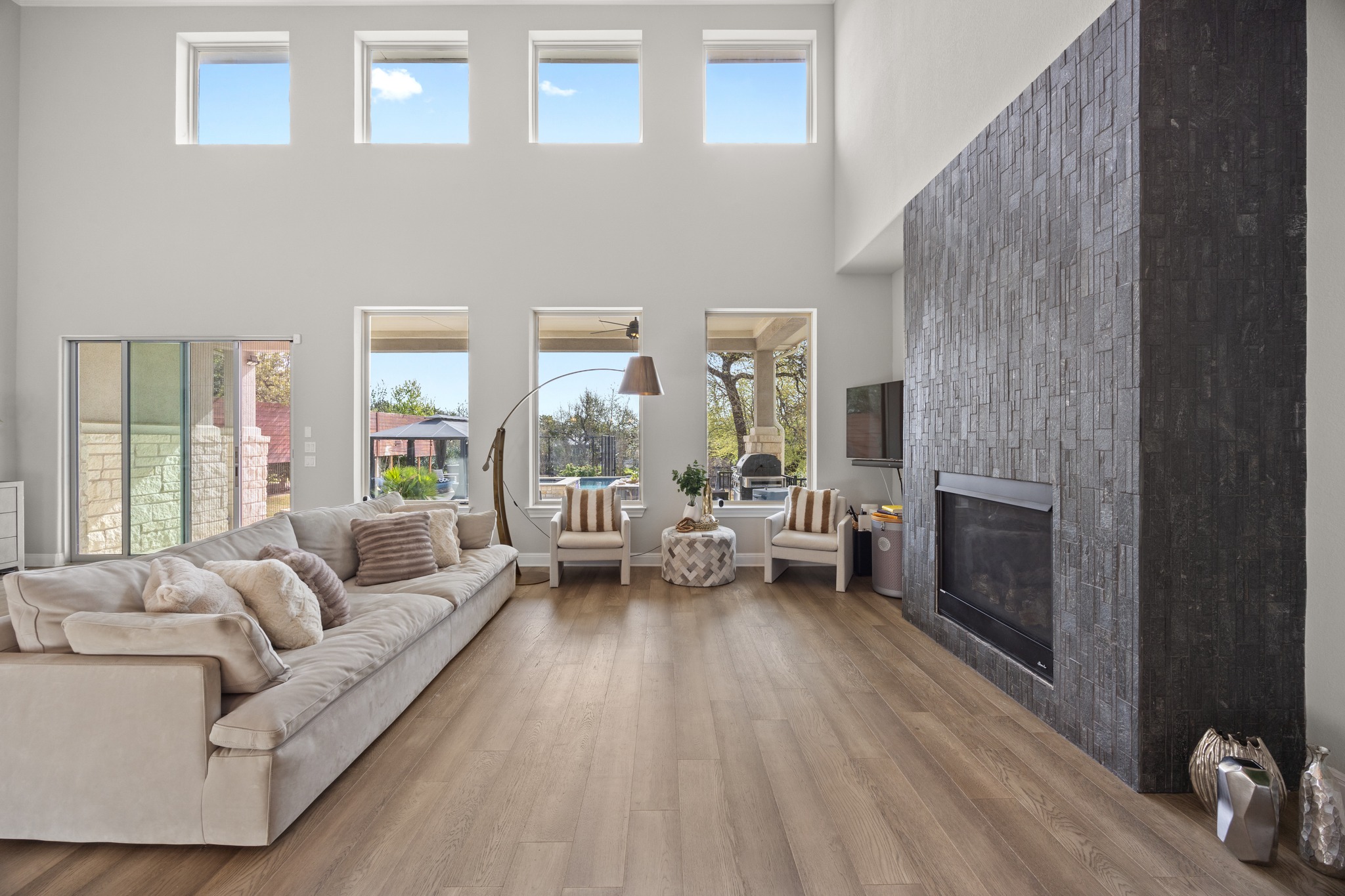 15705 Colinas Cove Bee Cave, TX 78738 - Photo 10 of 40 a living room with furniture and a fireplace