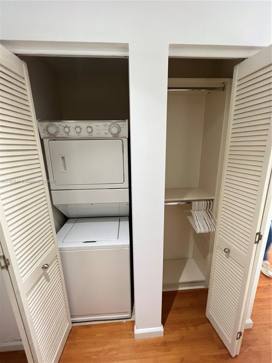 801 Brickell Key Boulevard, Unit 1506 Miami, FL 33131 - Photo 16 of 27 a utility room with dryer and washer