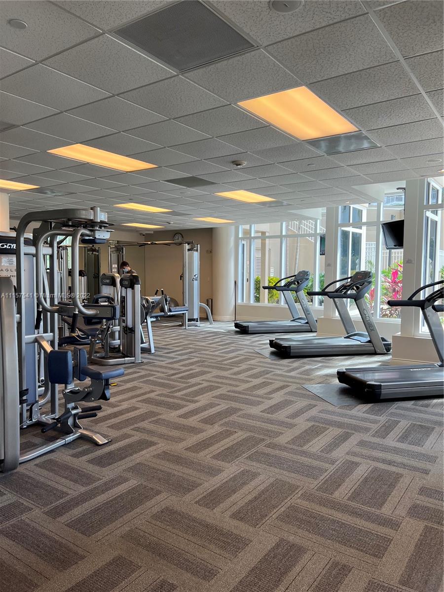 801 Brickell Key Boulevard, Unit 1506 Miami, FL 33131 - Photo 22 of 27 a view of a room with gym equipment
