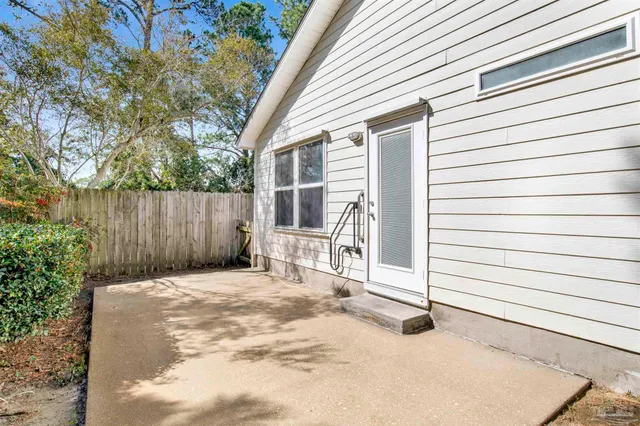 a view of a backyard with pathway