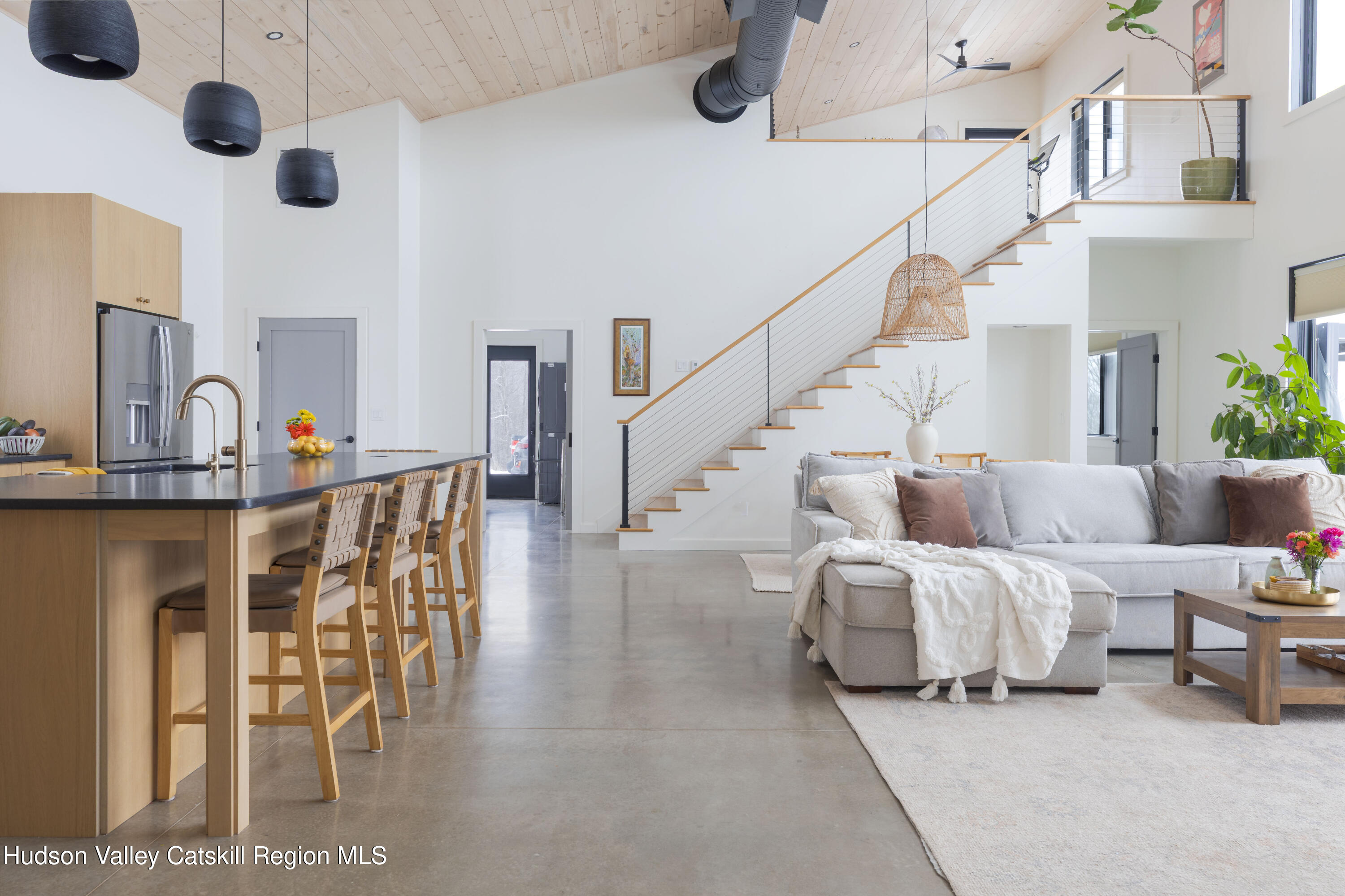 380 Decker Road Stamford, NY 12167 - Photo 12 of 31 a living room with furniture and a chandelier