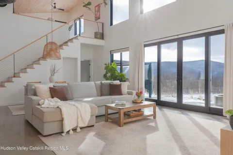 a bedroom with a bed and a mirror