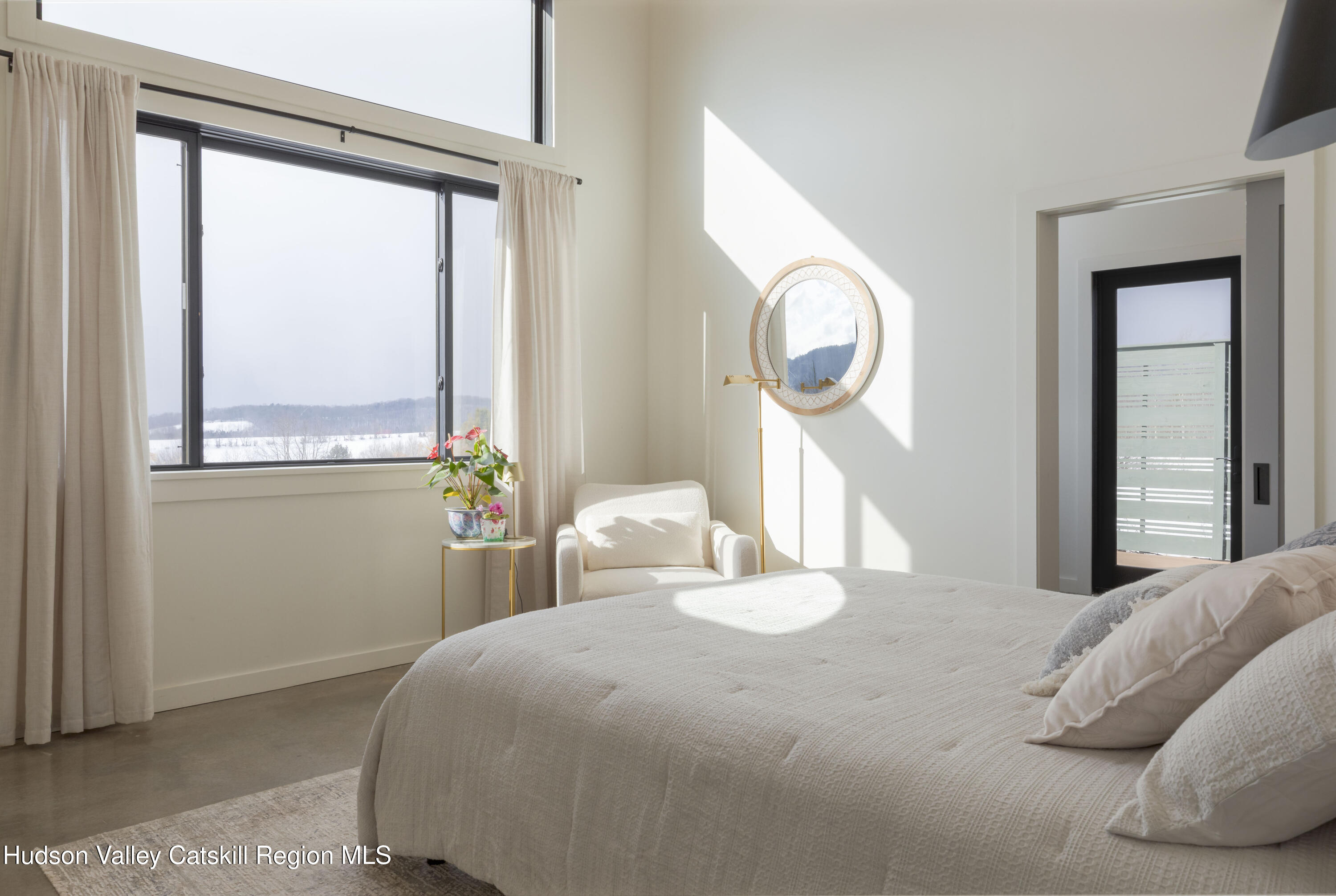 380 Decker Road Stamford, NY 12167 - Photo 18 of 31 a bedroom with a bed and a mirror