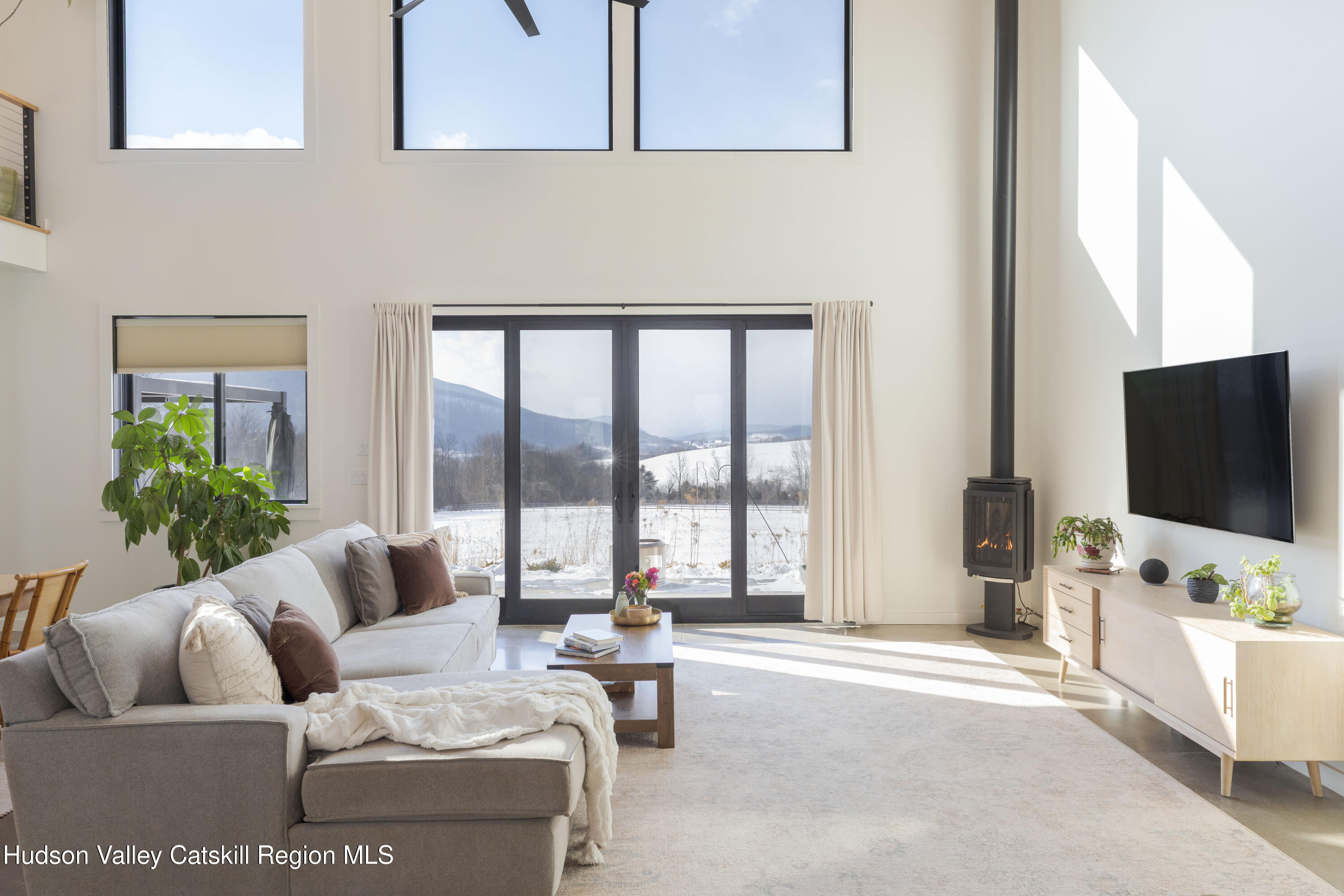 380 Decker Road Stamford, NY 12167 - Photo 2 of 31 a living room with furniture and a flat screen tv