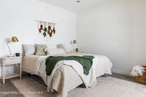 a bathroom with a toilet a sink and a mirror