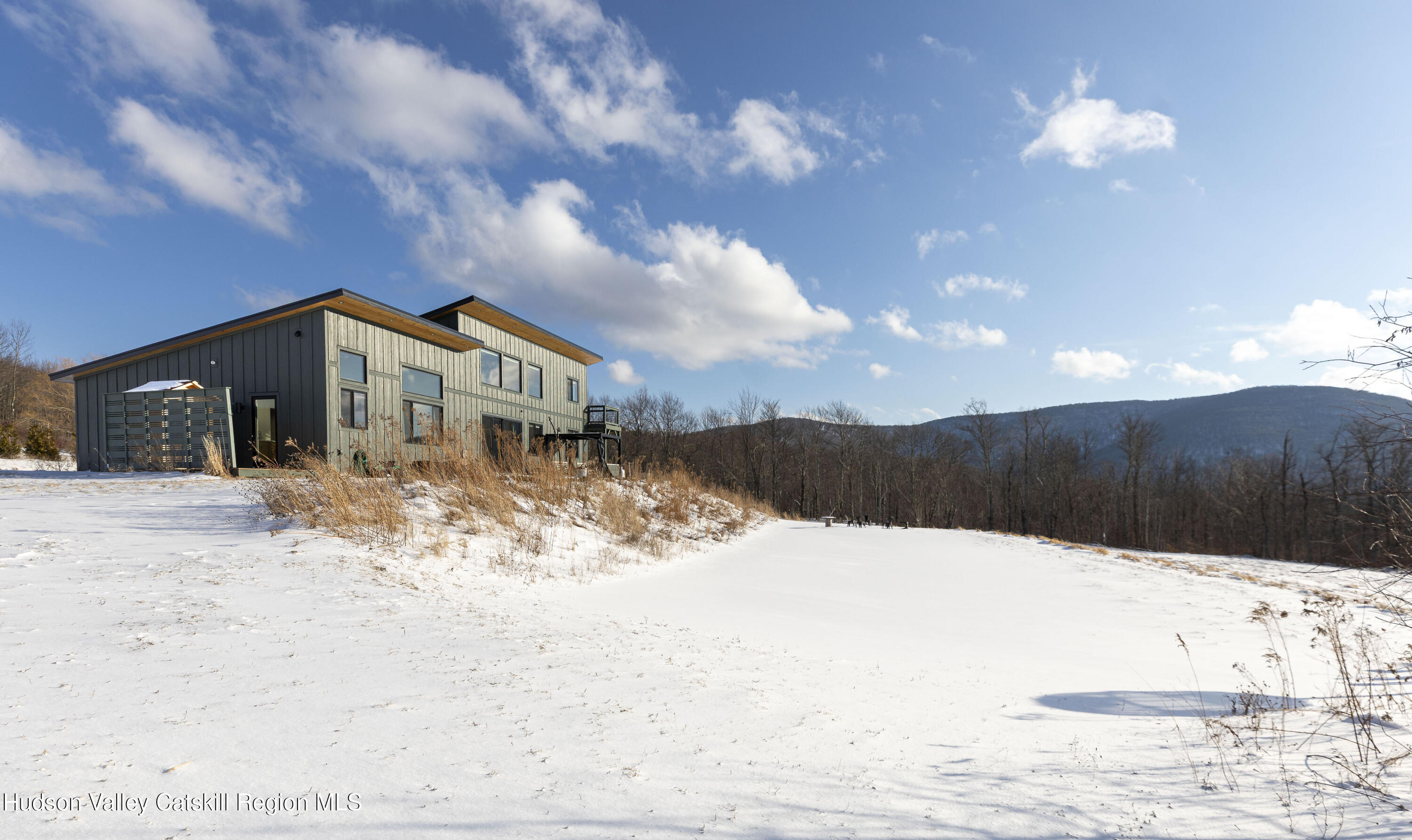 380 Decker Road Stamford, NY 12167 - Photo 30 of 31 a view of a house with a yard covered in snow