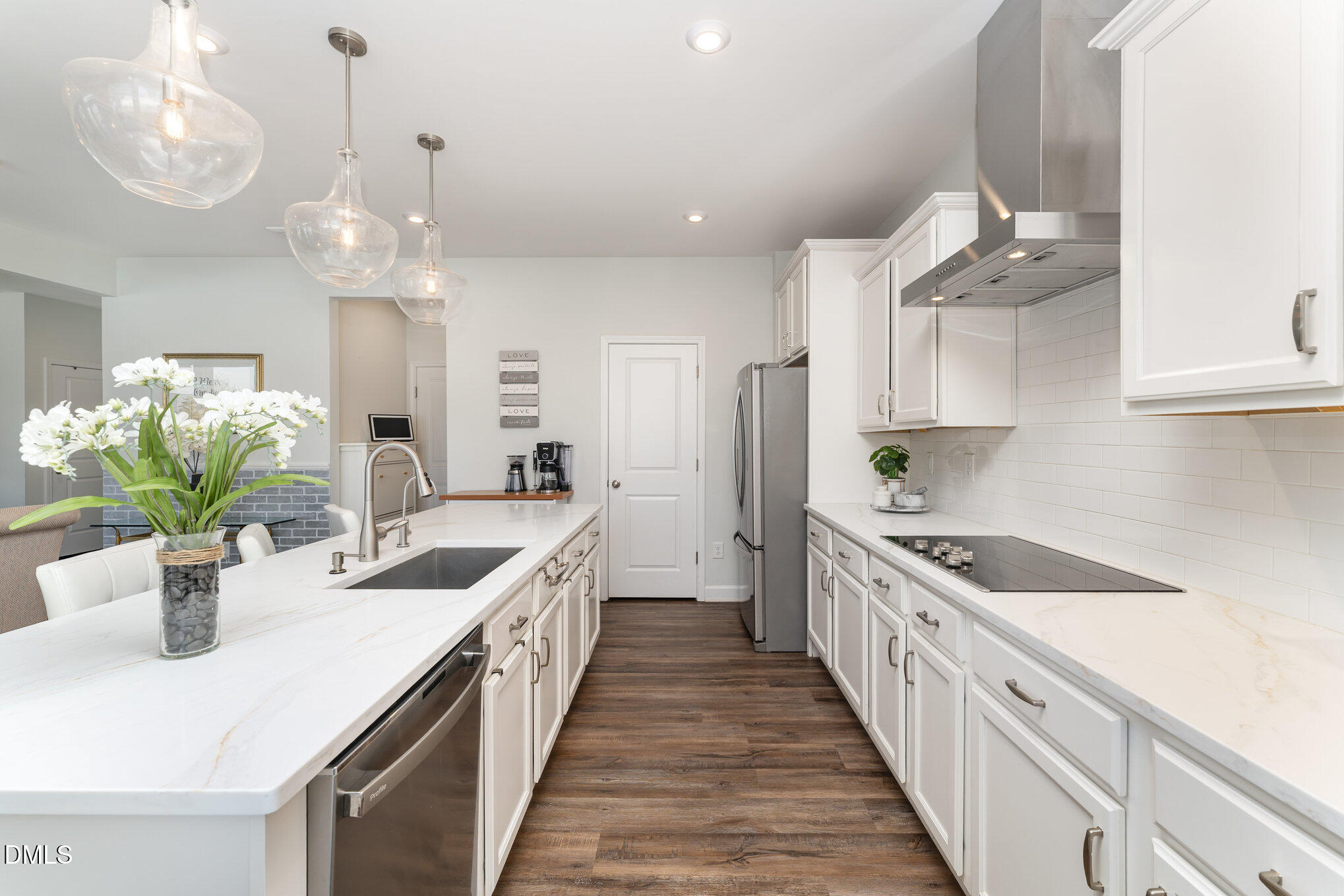 73 Lockhaven Drive Garner, NC 27529 - Photo 11 of 38 a kitchen with stove a sink and dishwasher with wooden floor