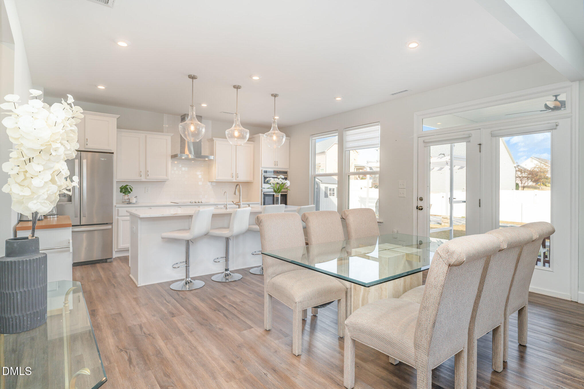 73 Lockhaven Drive Garner, NC 27529 - Photo 13 of 38 a view of a dining room with furniture and wooden floor