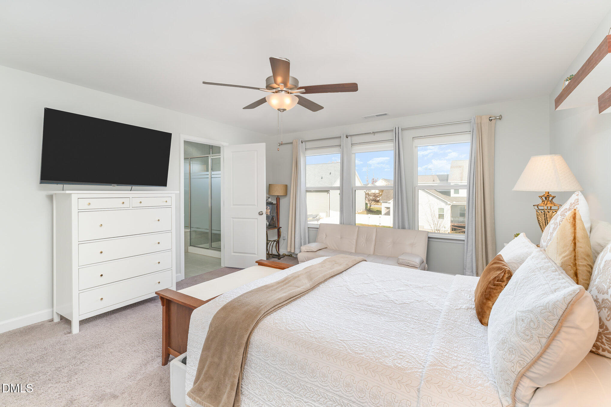 73 Lockhaven Drive Garner, NC 27529 - Photo 17 of 38 a bedroom with a bed and a flat screen tv