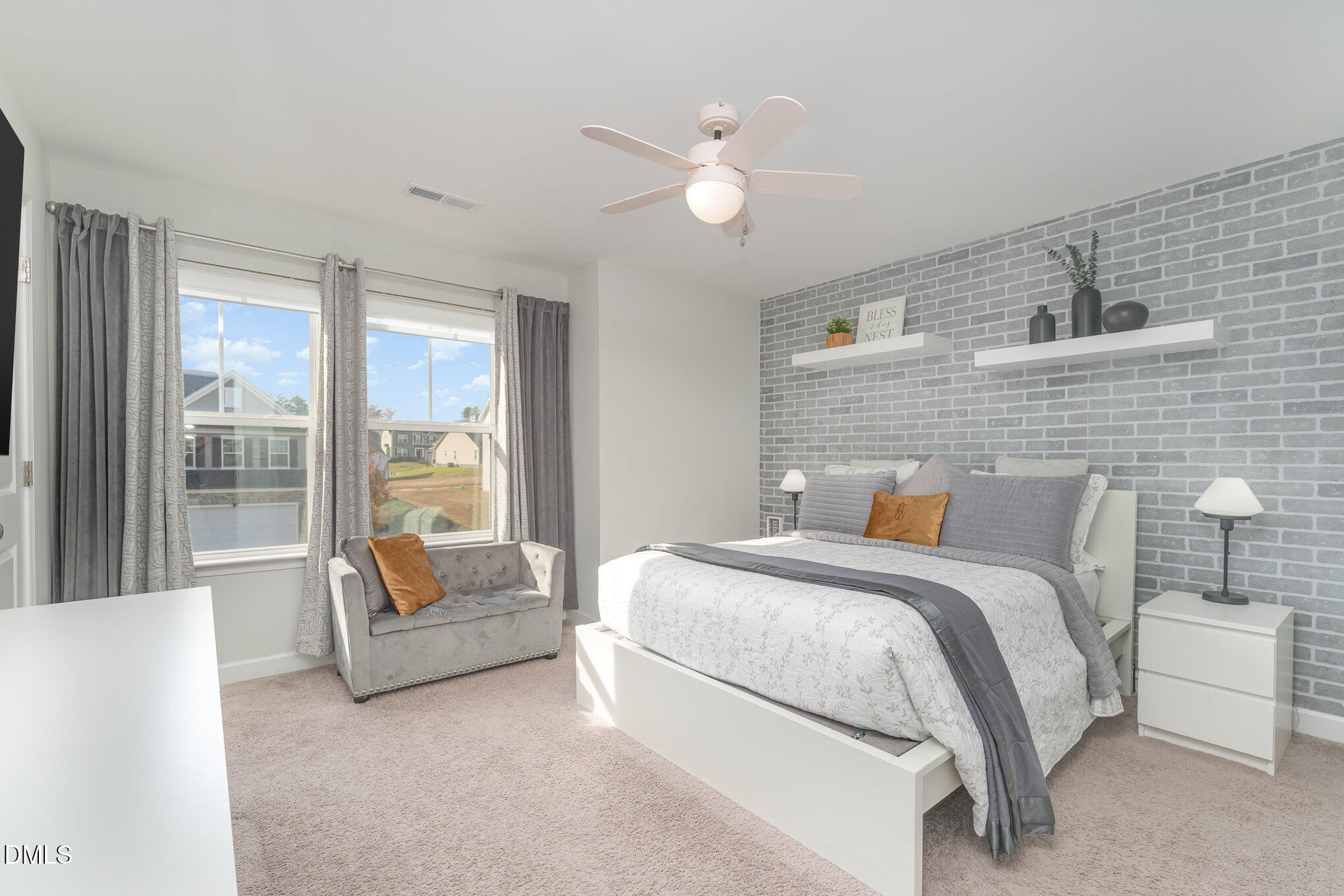 73 Lockhaven Drive Garner, NC 27529 - Photo 20 of 38 a bedroom with a bed and ceiling fan