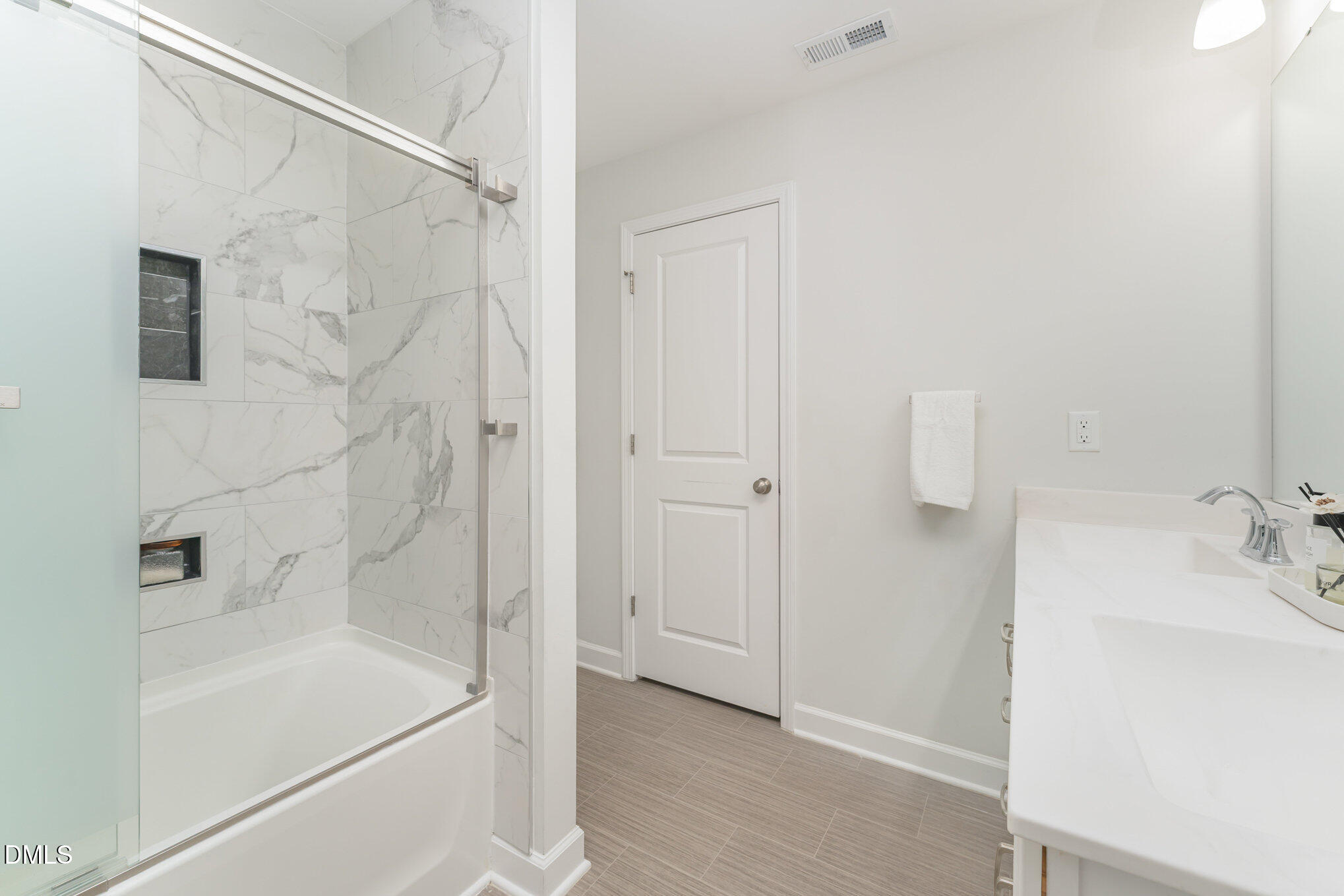 73 Lockhaven Drive Garner, NC 27529 - Photo 22 of 38 a bathroom with a bathtub and shower