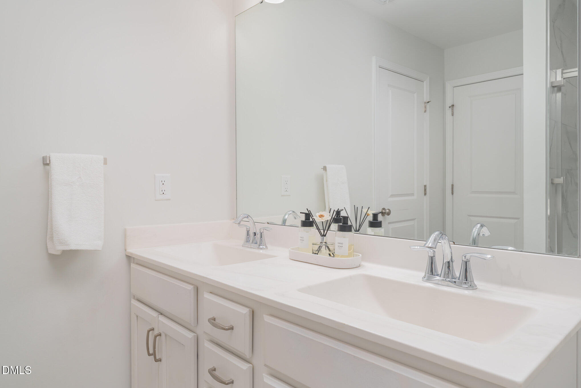 73 Lockhaven Drive Garner, NC 27529 - Photo 23 of 38 a bathroom with double vanity sink and a mirror