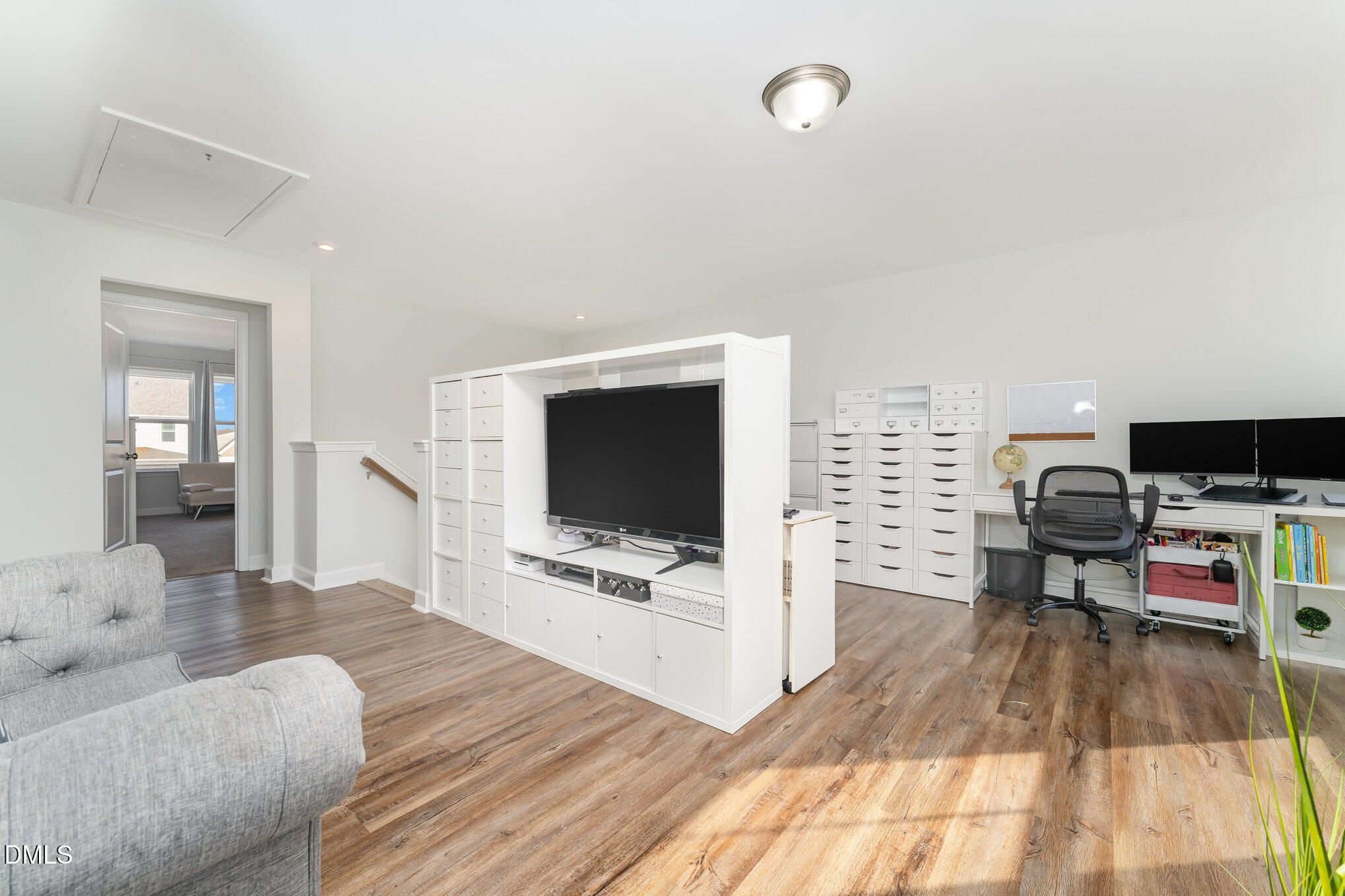 73 Lockhaven Drive Garner, NC 27529 - Photo 25 of 38 a living room with furniture and a flat screen tv