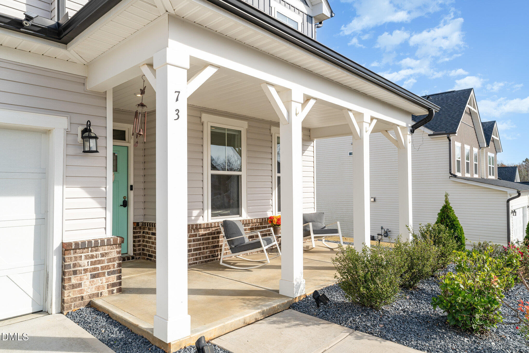 73 Lockhaven Drive Garner, NC 27529 - Photo 4 of 38 a front view of a house with a glass windows and a glass door