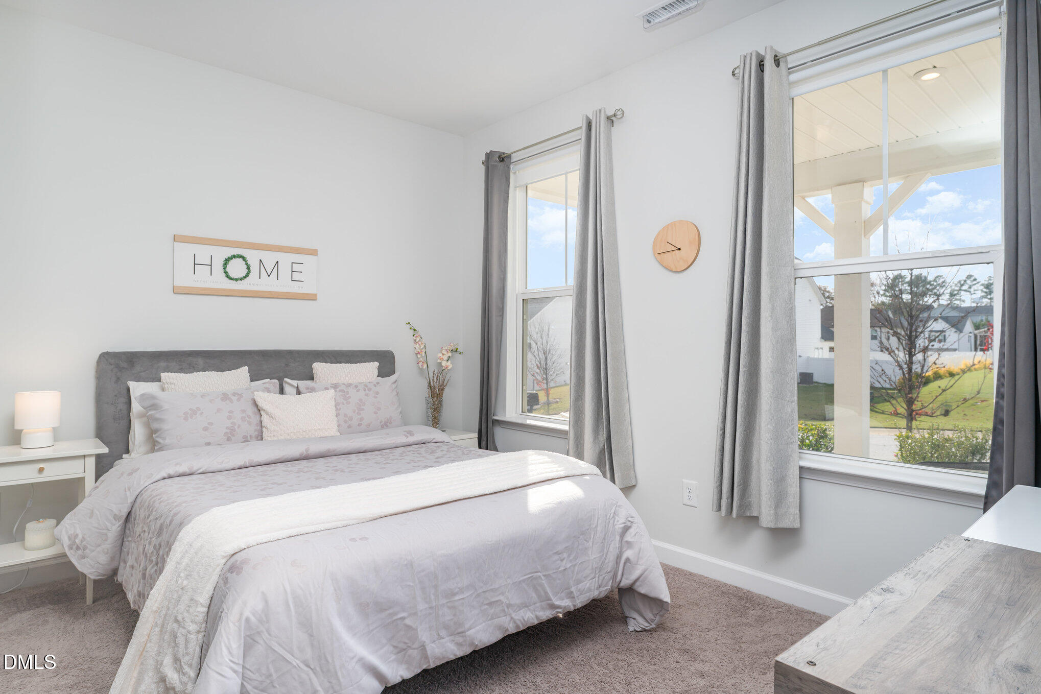 73 Lockhaven Drive Garner, NC 27529 - Photo 7 of 38 a bedroom with a bed and a large window