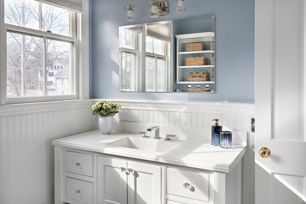 272 North Street Hingham, MA 02043 - Photo 11 of 17 a bathroom with a sink and a window