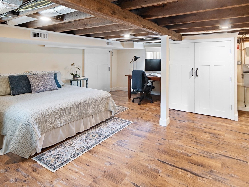 272 North Street Hingham, MA 02043 - Photo 12 of 17 a spacious bedroom with a bed and a table
