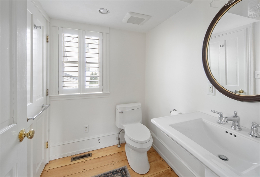272 North Street Hingham, MA 02043 - Photo 14 of 17 a bathroom with a sink and a mirror