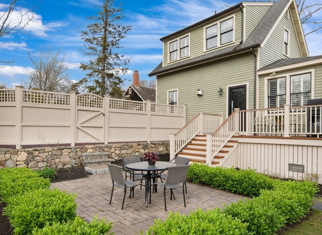 272 North Street Hingham, MA 02043 - Photo 16 of 17 a front view of a house with a yard table and chairs