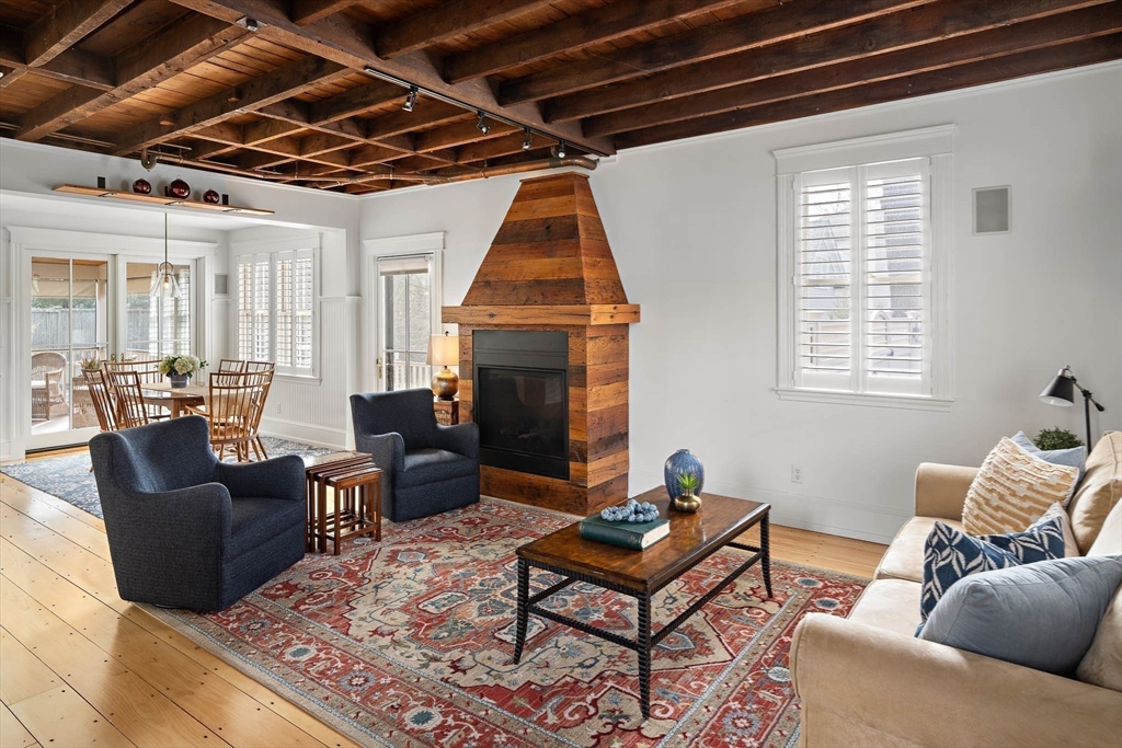 272 North Street Hingham, MA 02043 - Photo 2 of 17 a living room with furniture ceiling fan and a window