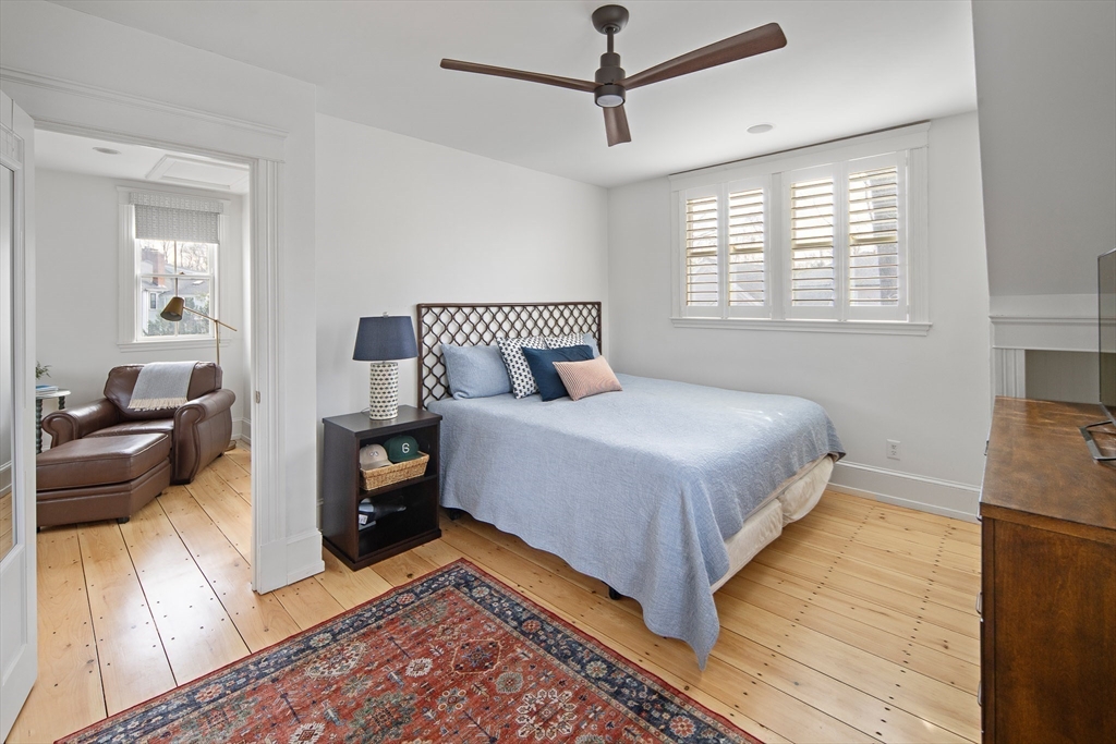 272 North Street Hingham, MA 02043 - Photo 8 of 17 a bedroom with a large bed and a couch