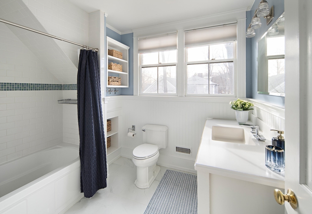 272 North Street Hingham, MA 02043 - Photo 10 of 17 a bathroom with a sink toilet and shower