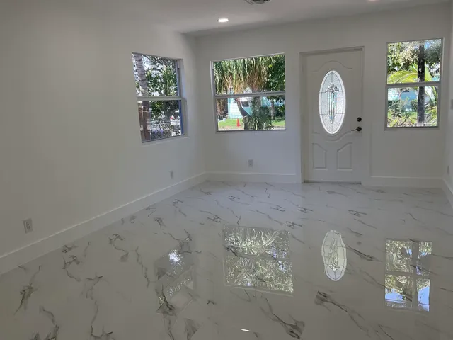 a view of a hallway with entryway