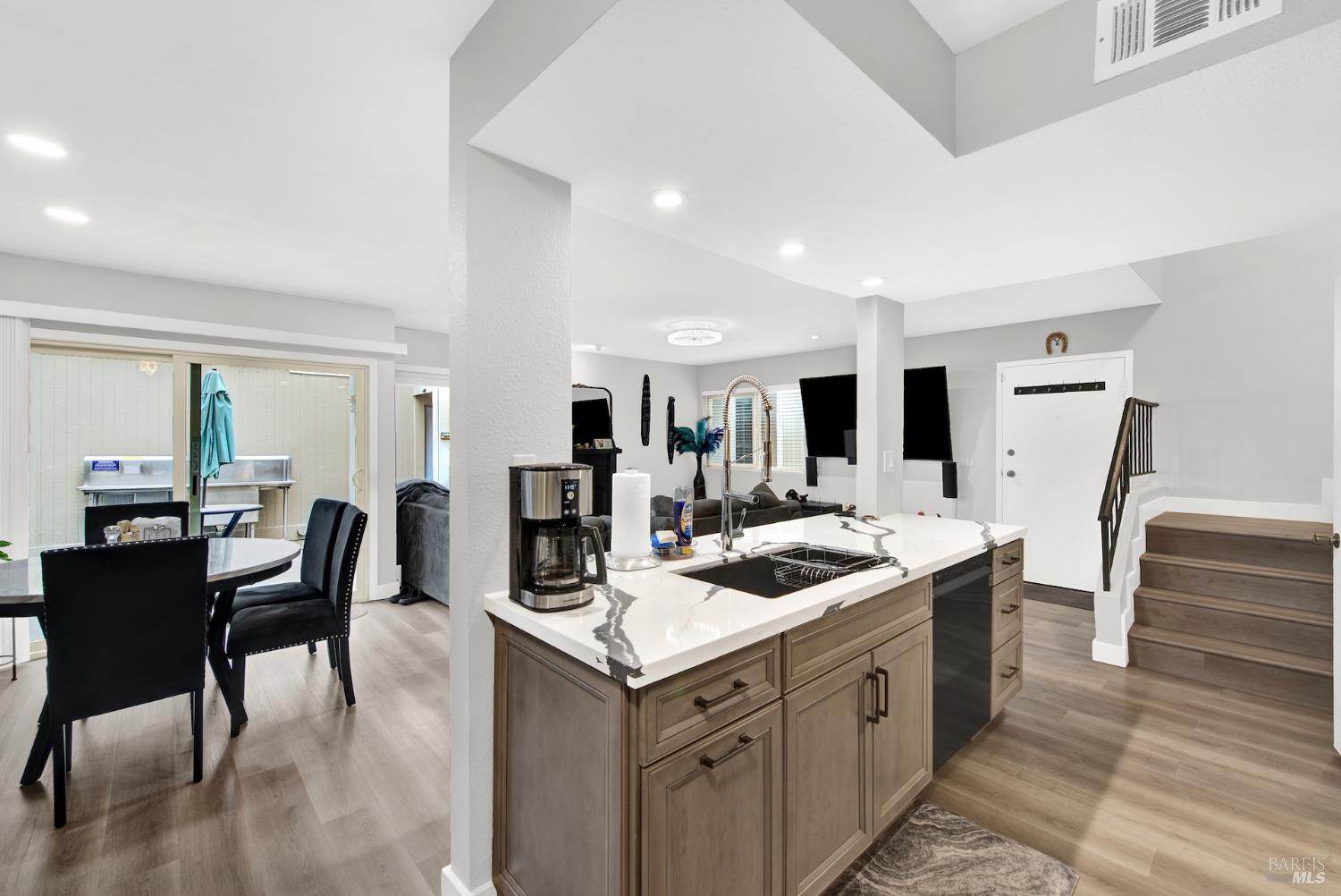 216 Apollo, Unit 7 Hercules, CA 94547 - Photo 15 of 29 a kitchen with a stove a refrigerator and dining table